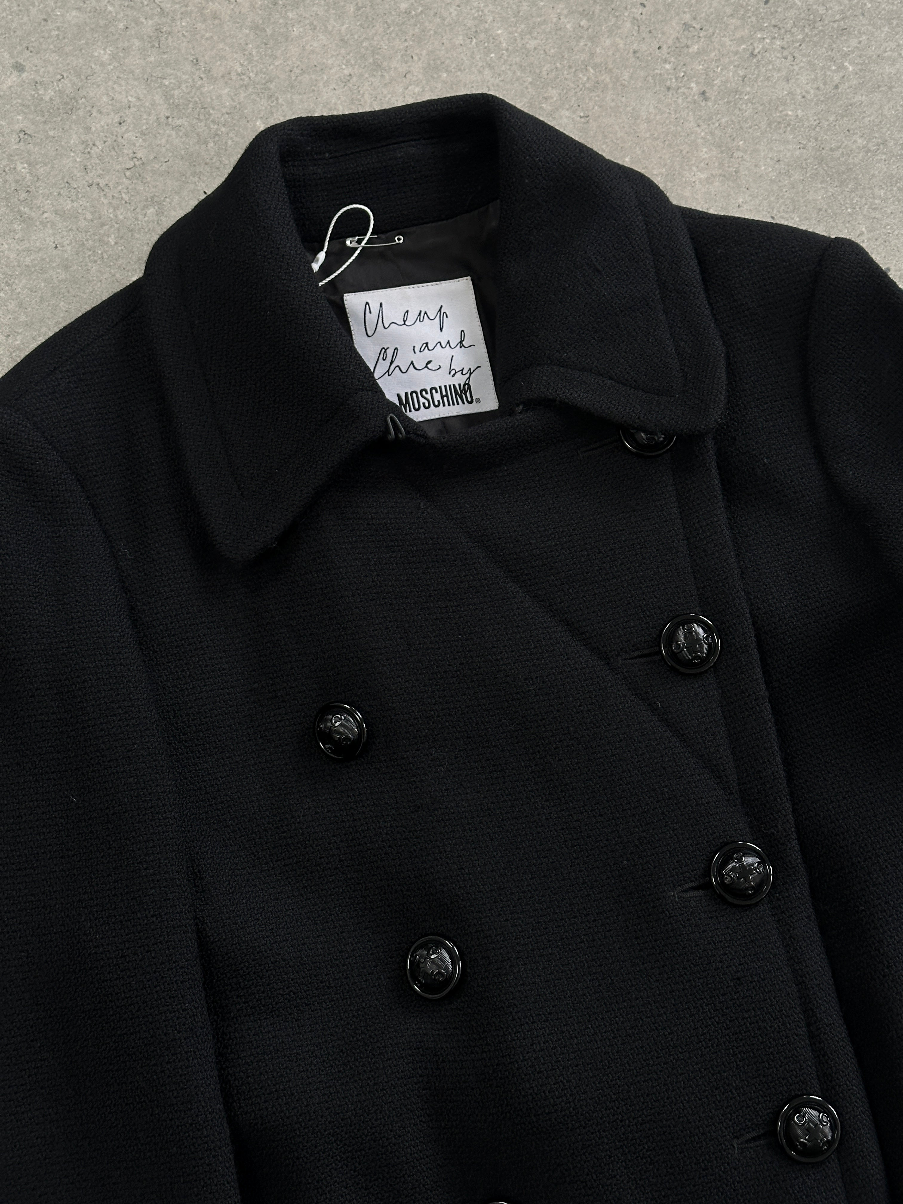 Moschino Cheap & Chic double-breasted coat in size M, stylish coat with classic design and button details, displayed on a hanger.