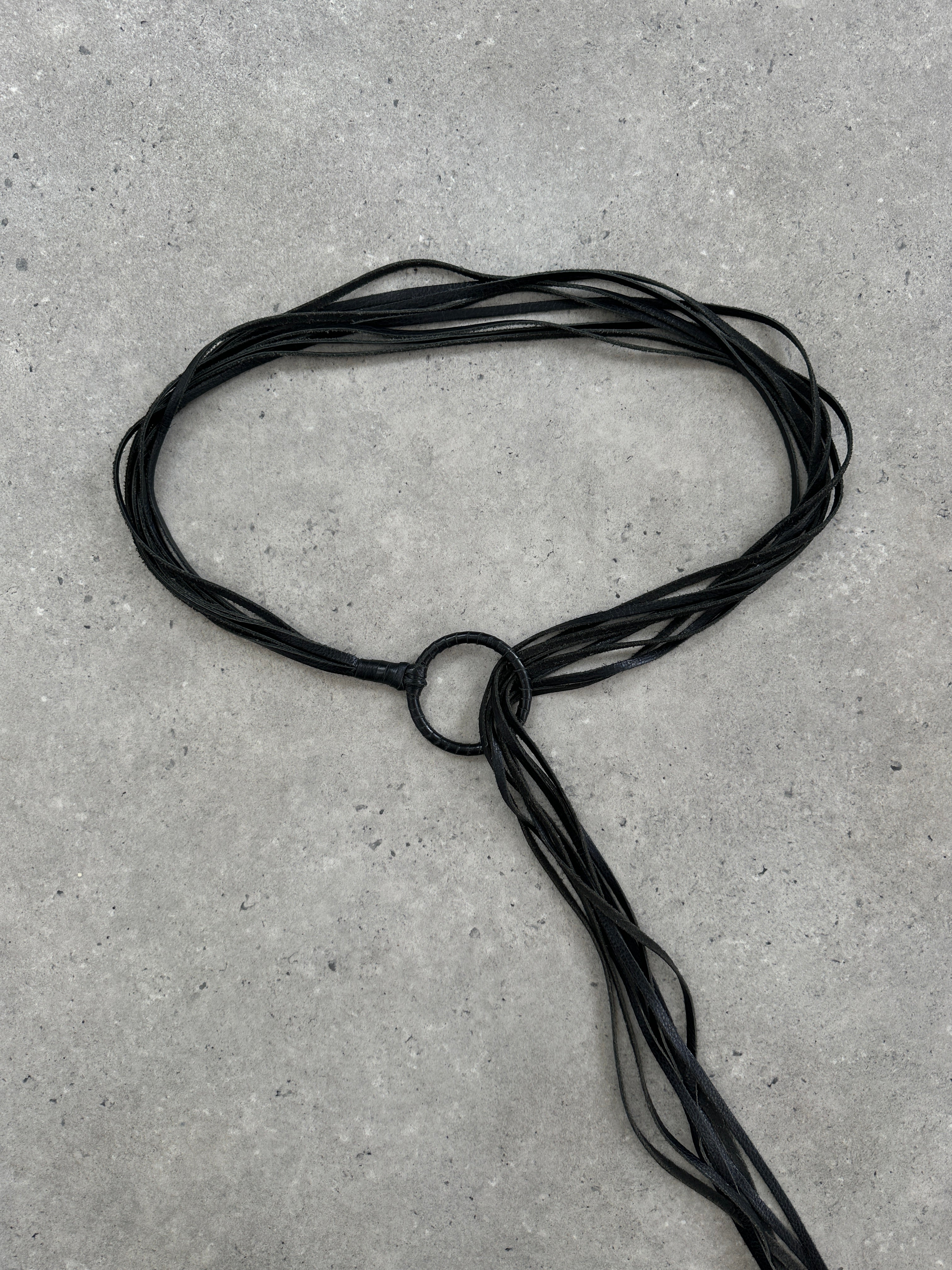 Vintage leather tassel belt in one size with decorative tassels and classic design, perfect for adding style to casual outfits.