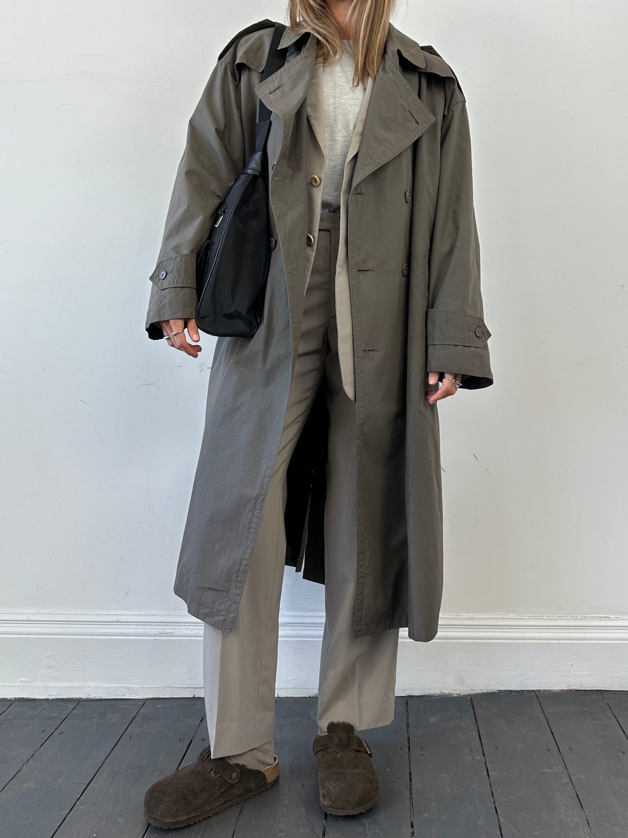 Christian Dior belted cotton wool trench coat in beige, showing classic collar, belted waist, and double-breasted design.