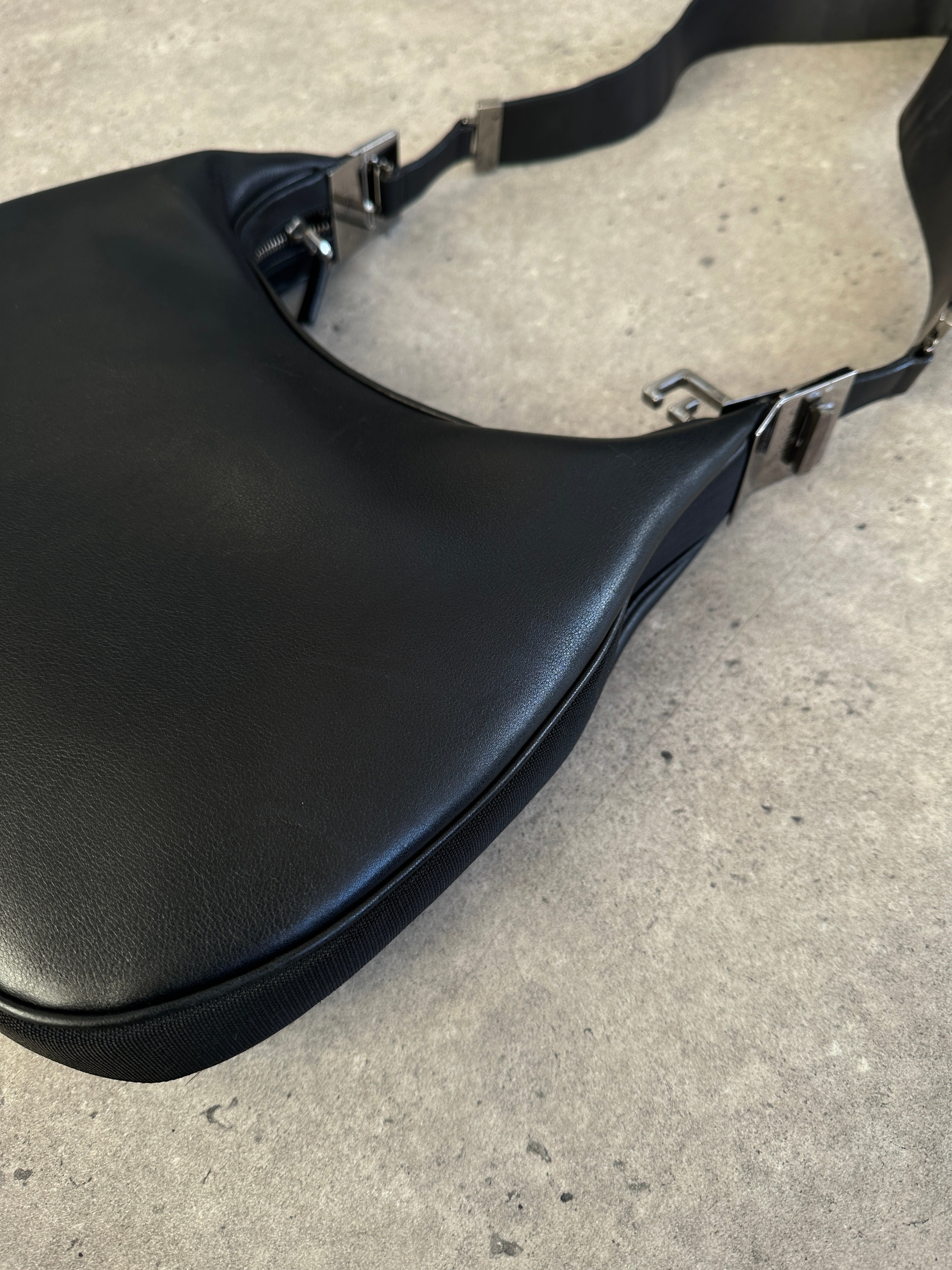 Gucci 1990s Tom Ford GG 3-in-1 leather attache bag with handles and compartments, classic design, and Gucci branding.