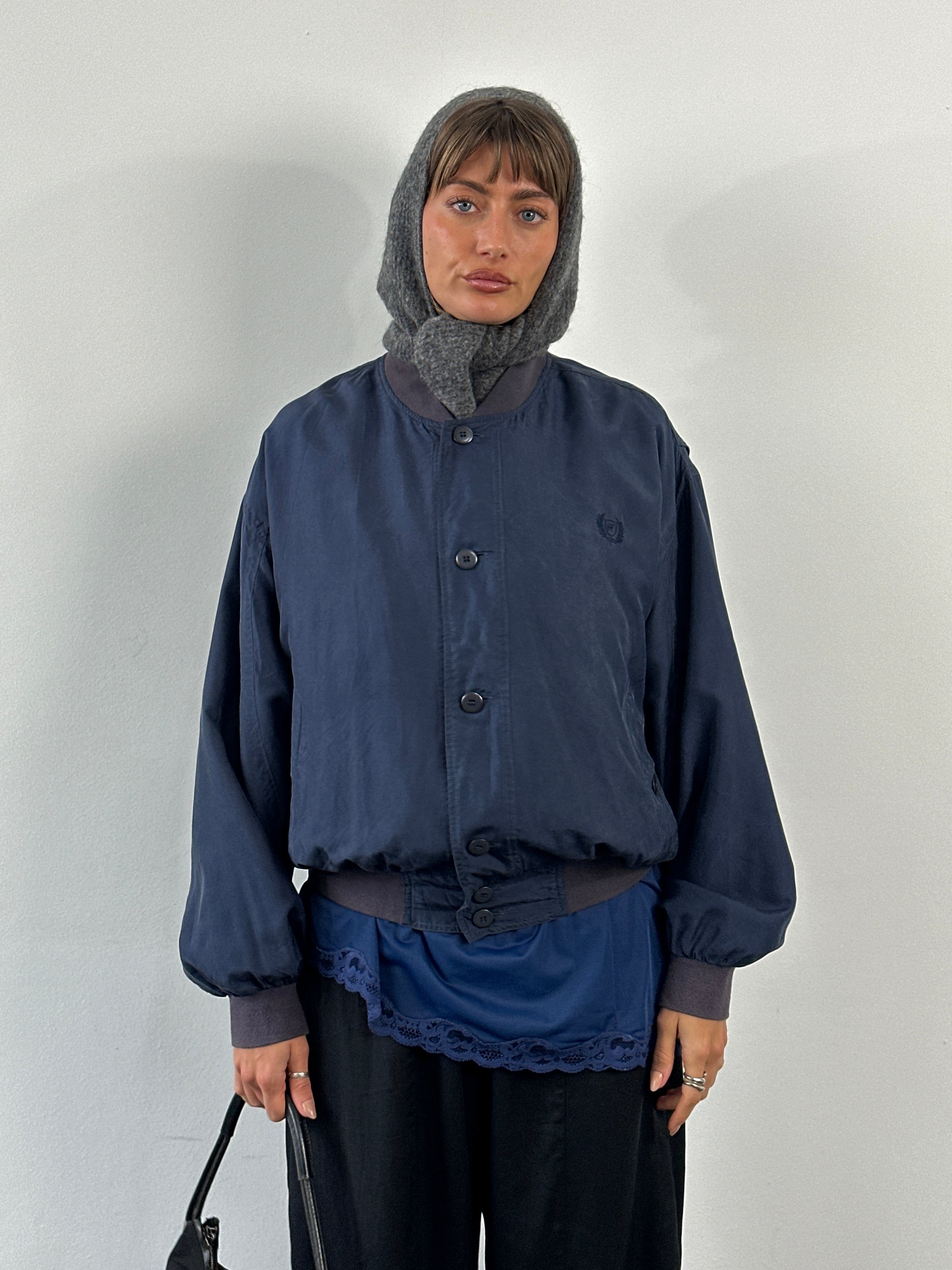 Vintage 1990s pure silk bomber jacket in size large, featuring a classic design and smooth silk fabric.