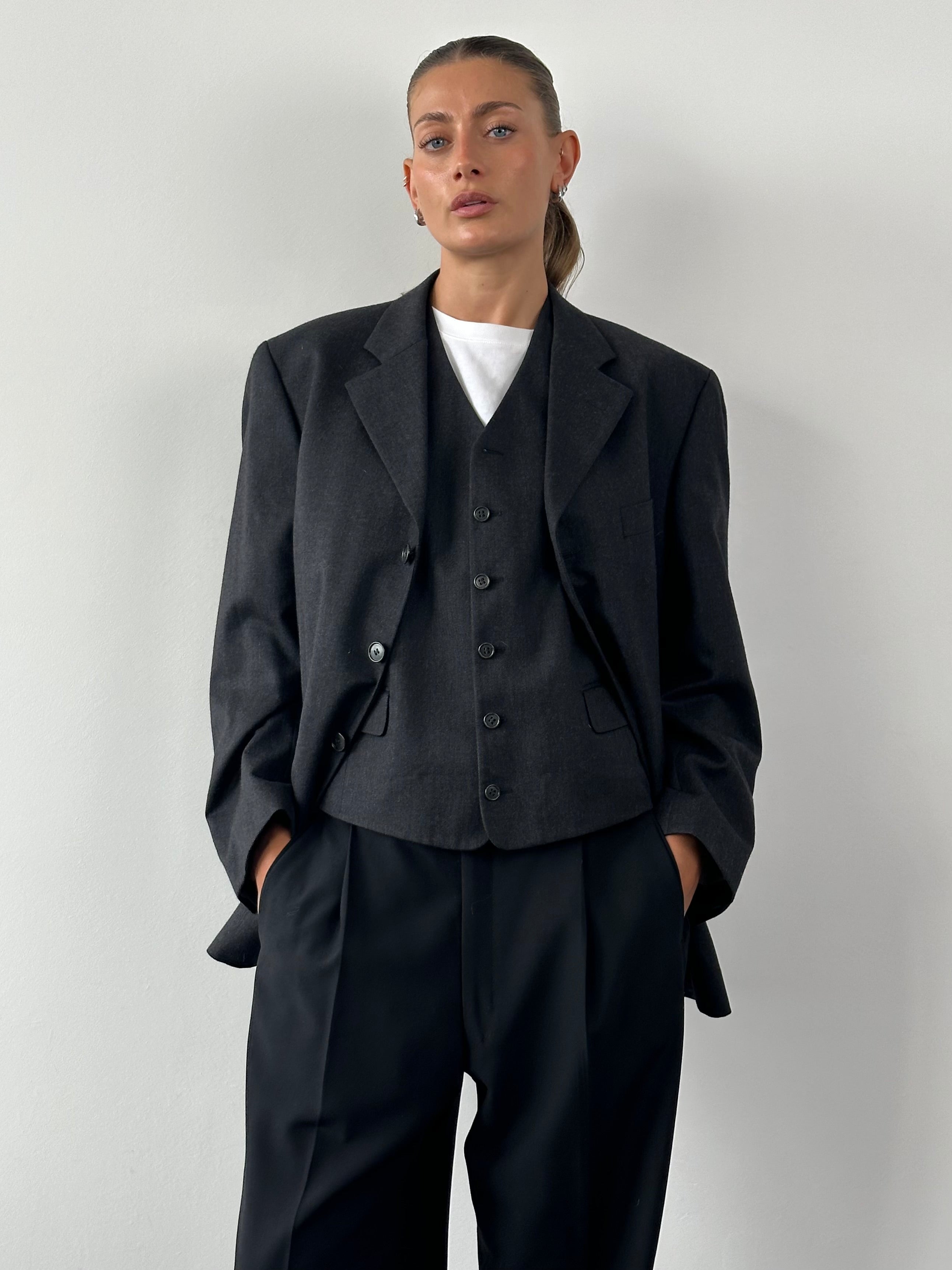 Yves Saint Laurent Pour Homme wool blazer two-piece set in size 40S/L, tailored with classic lapel and sleek design.