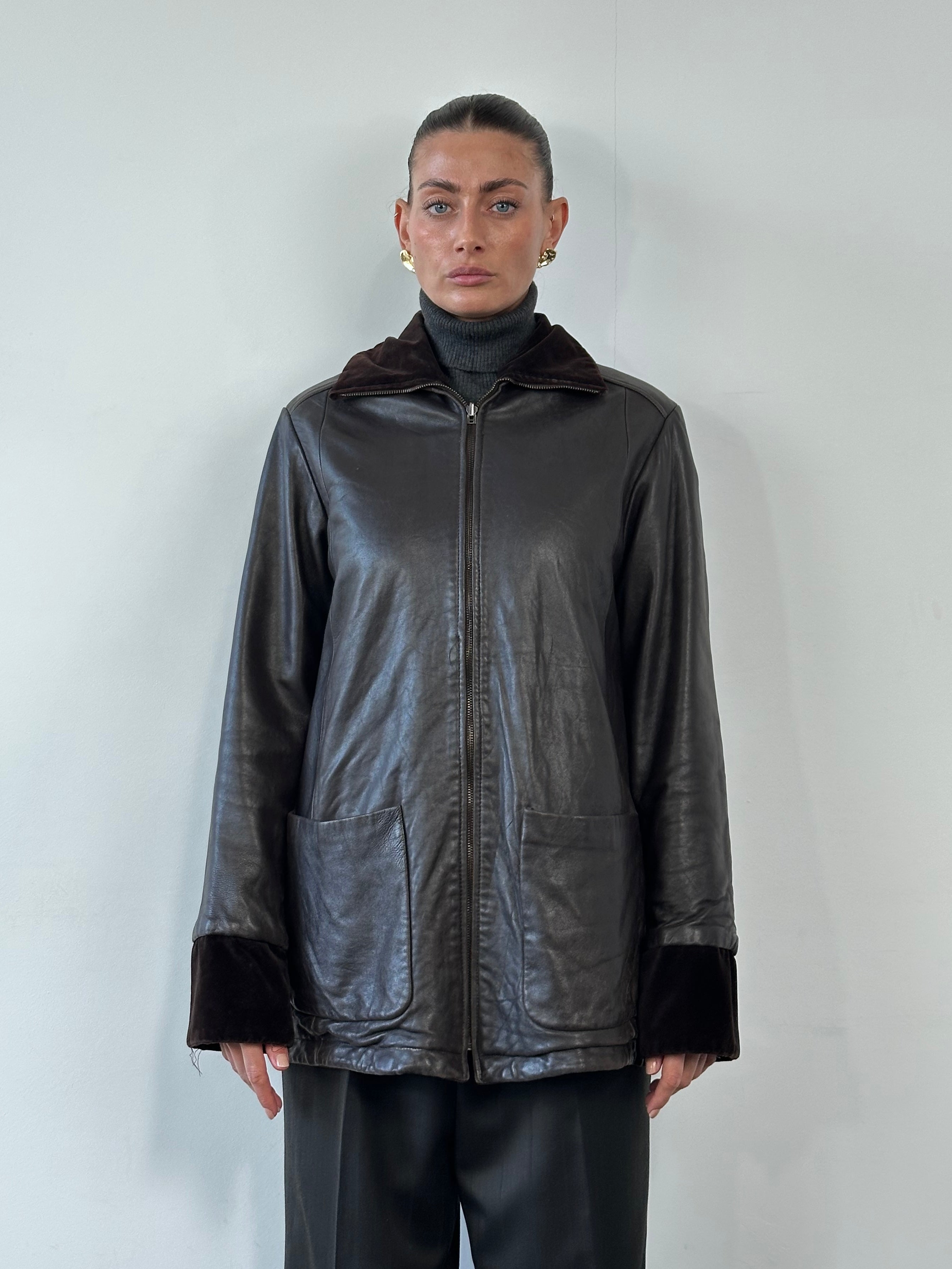 Kenneth Cole 1990s reversible leather and velvet jacket, men's size M, showing the textured leather side and soft velvet interior.