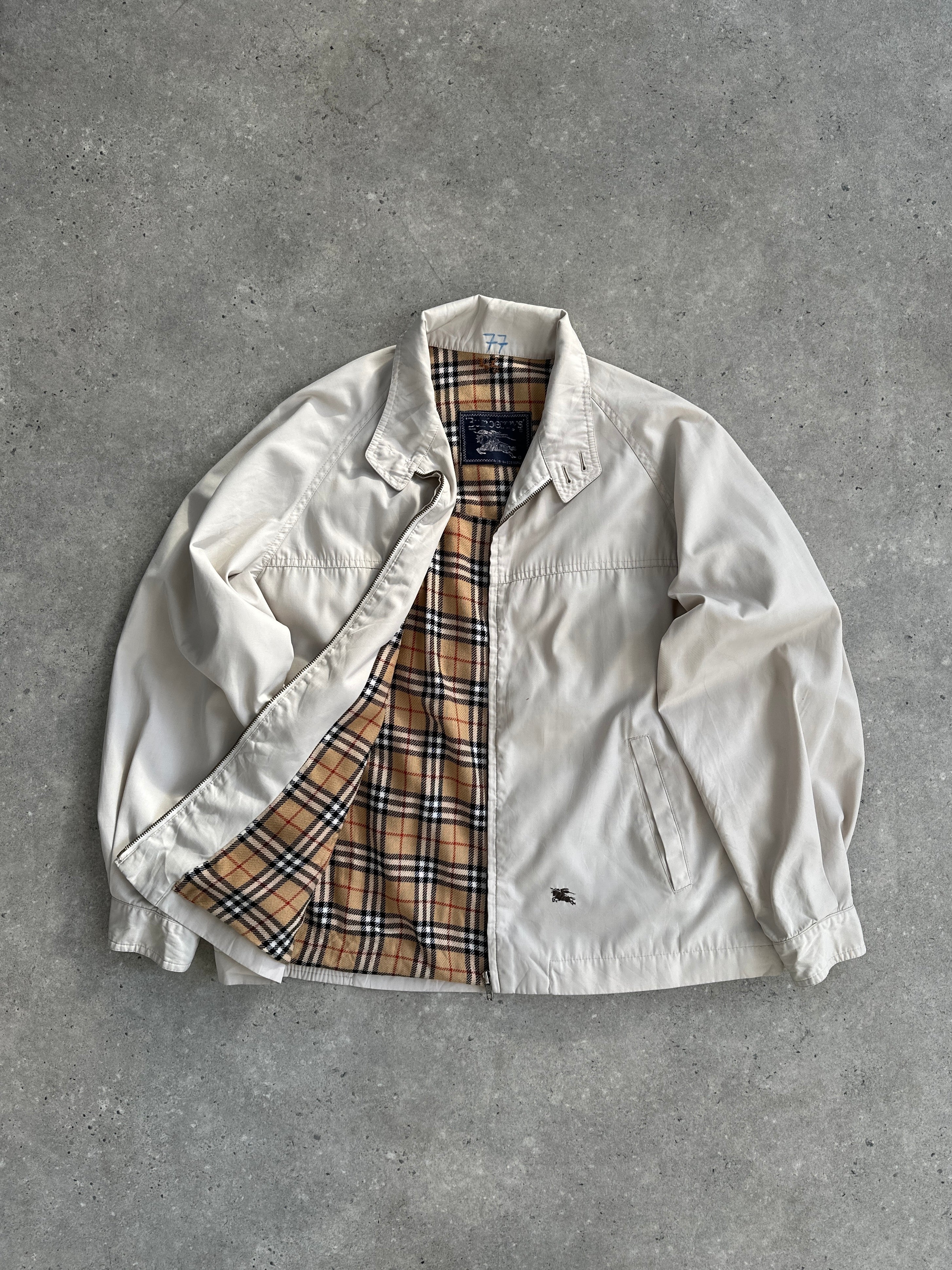 Burberry Nova Check logo bomber jacket in size L, featuring classic check pattern and ribbed cuffs on a stylish outerwear piece.