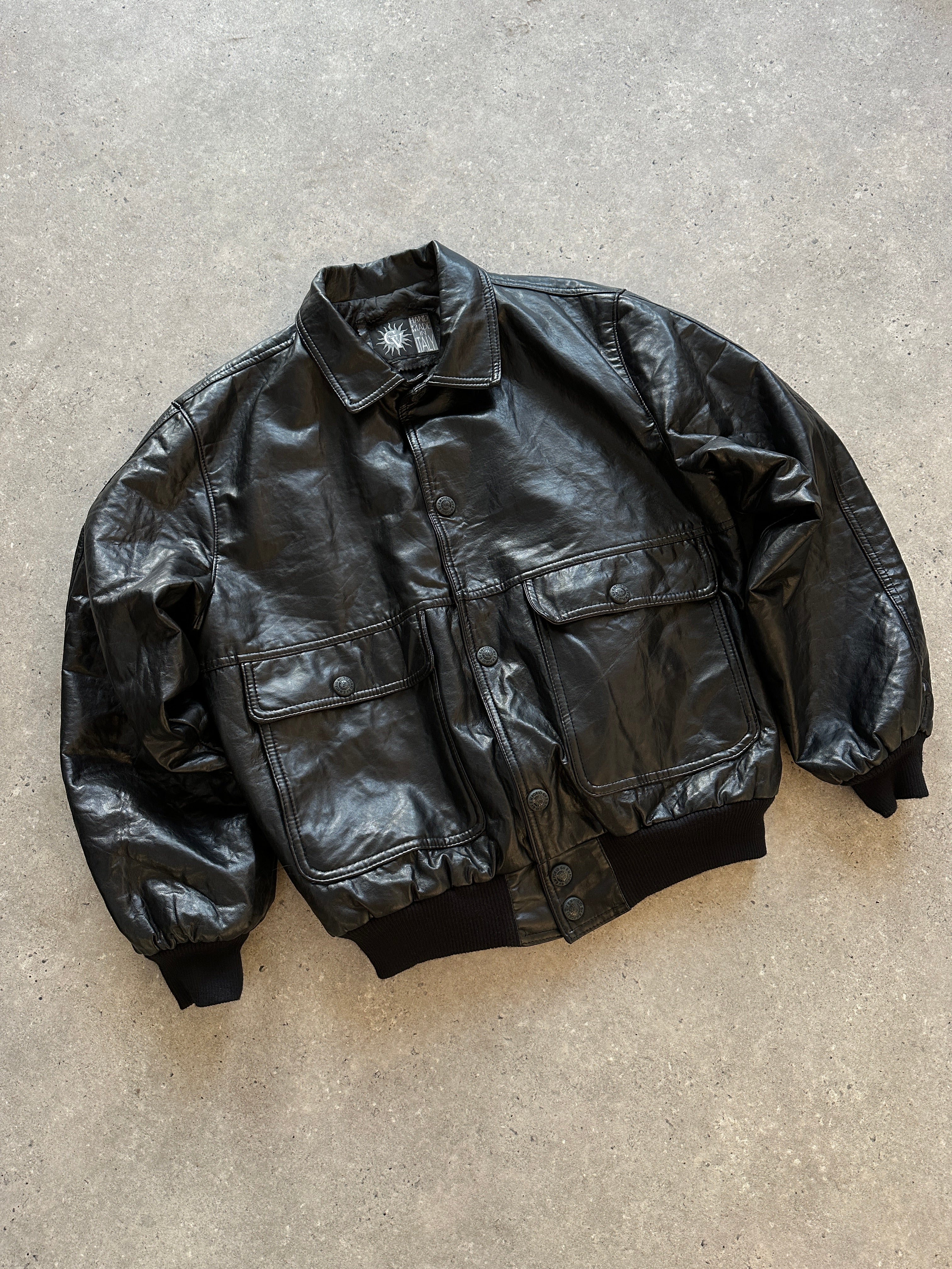 Vintage Italian vintage faux leather bomber jacket in size large, featuring classic design and textured leather finish.
