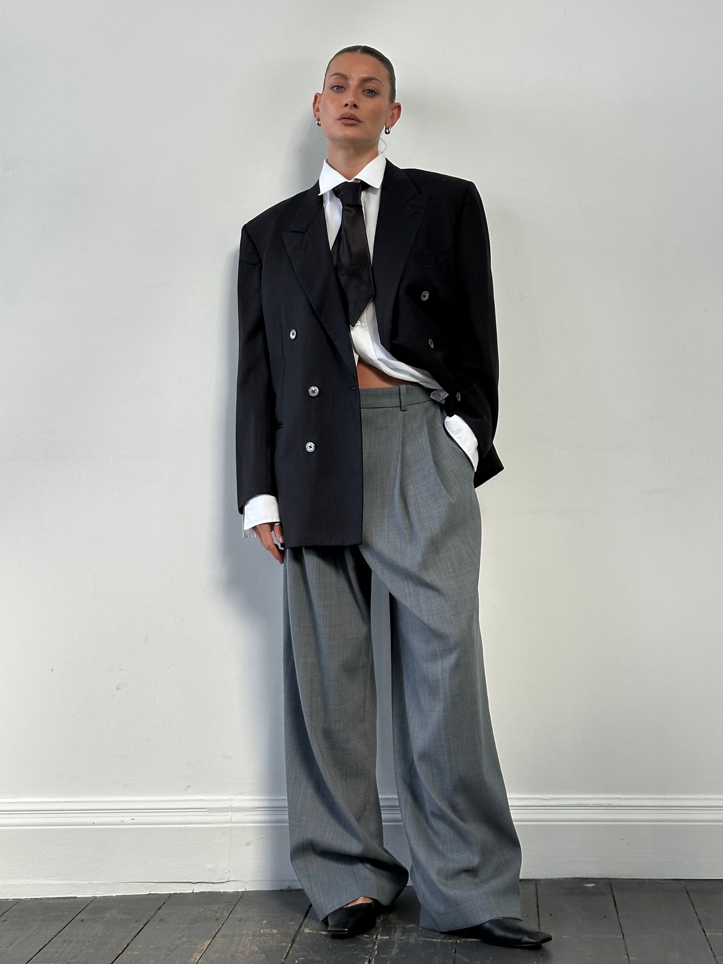 Yves Saint Laurent 80s wool double-breasted blazer in size 40R/L, featuring classic tailored fit and button details.