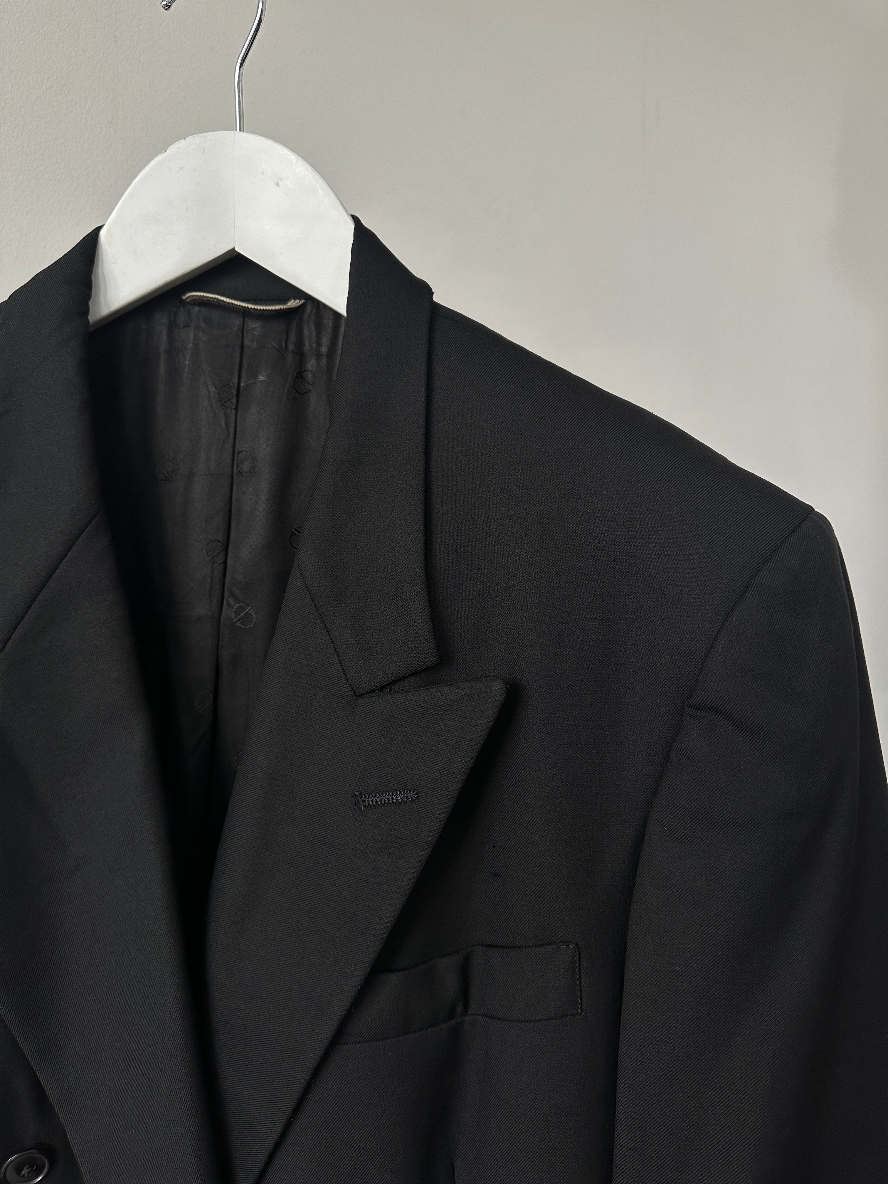Christian Dior wool double-breasted blazer in size L/XL, tailored fit with classic lapels and button details.
