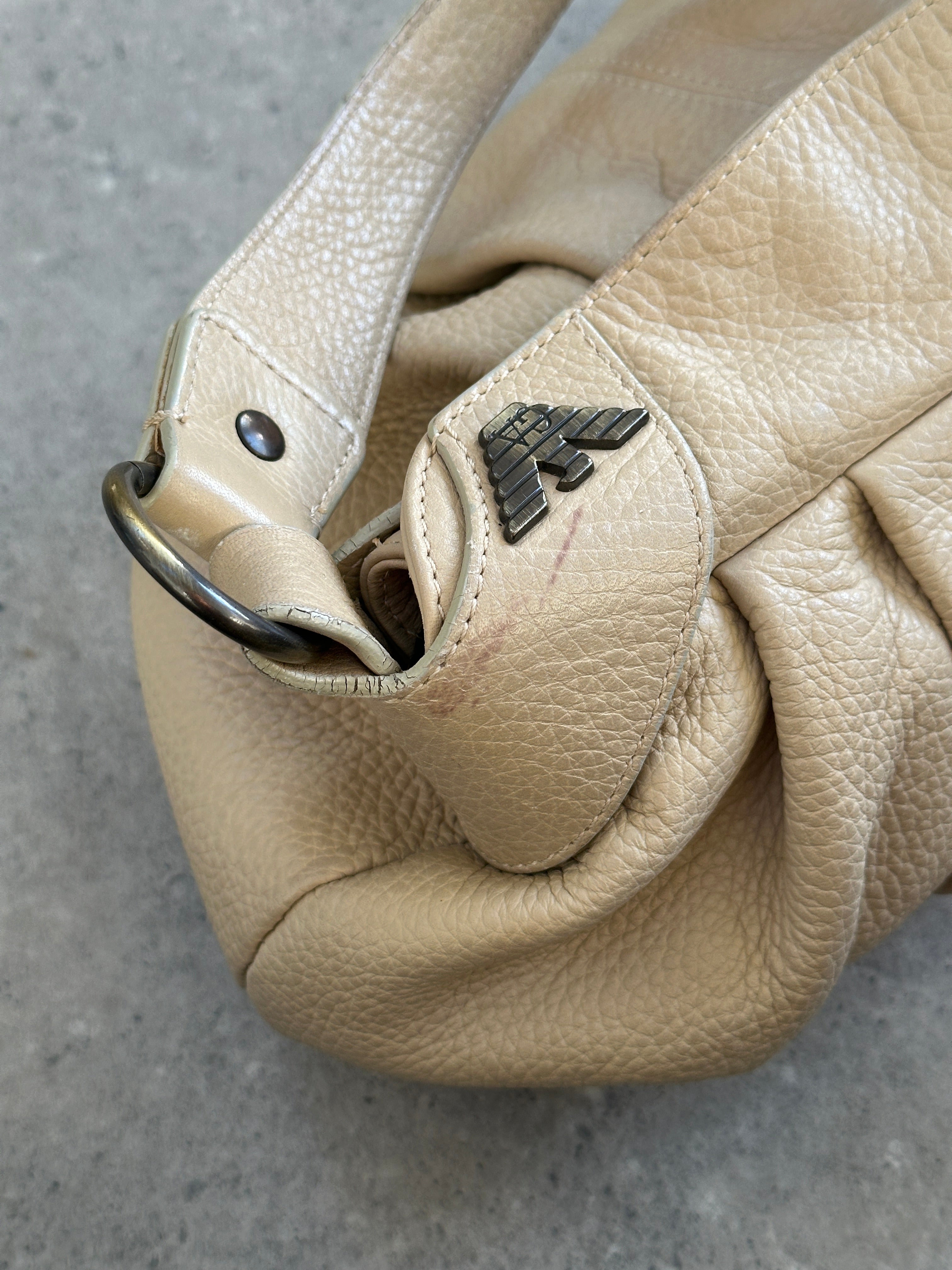 Emporio Armani leather shoulder bag with pleated design from the 2000s, featuring a stylish and structured look.