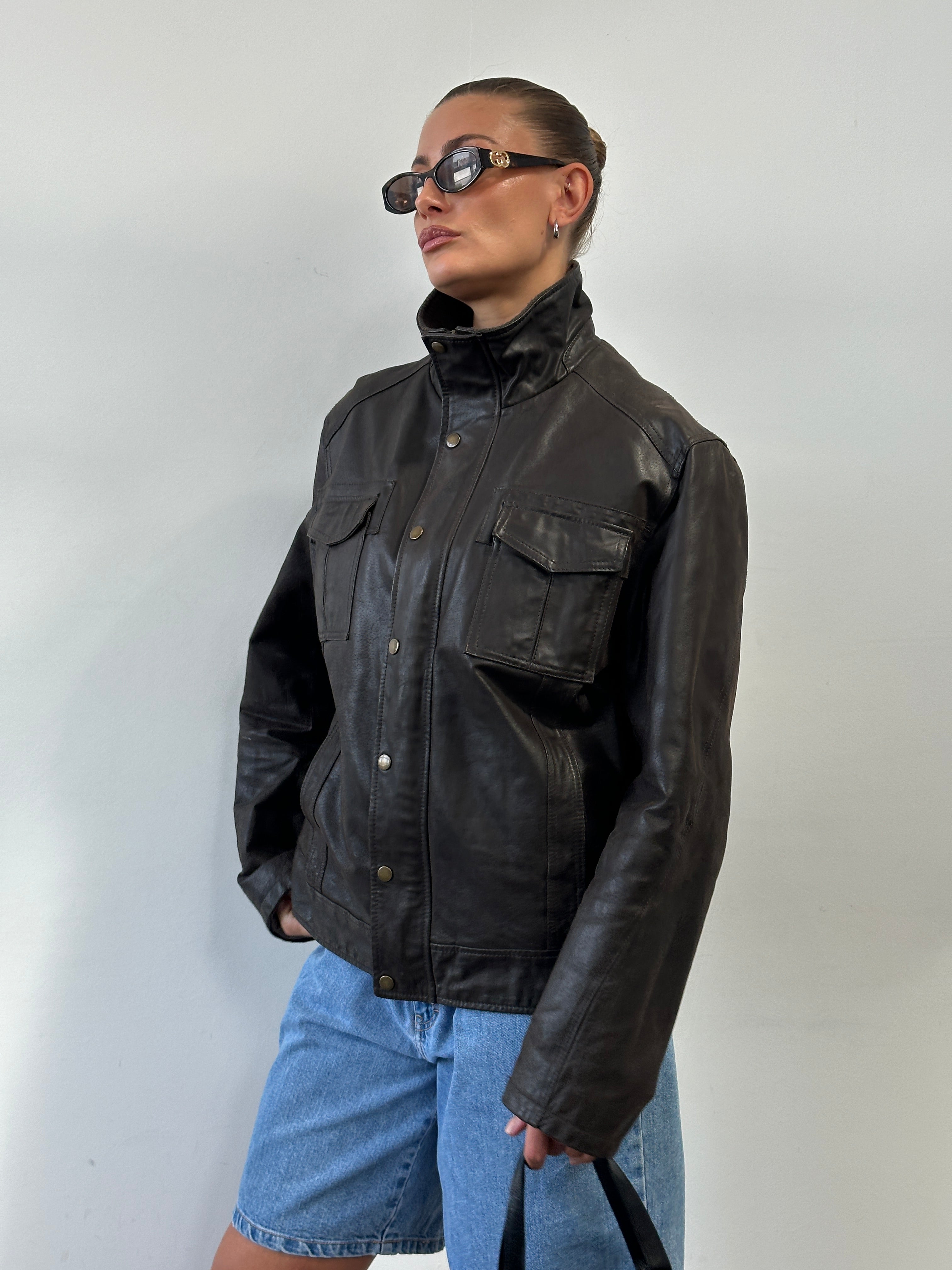 Vintage high neck leather jacket in size XL, featuring classic design and smooth leather material.