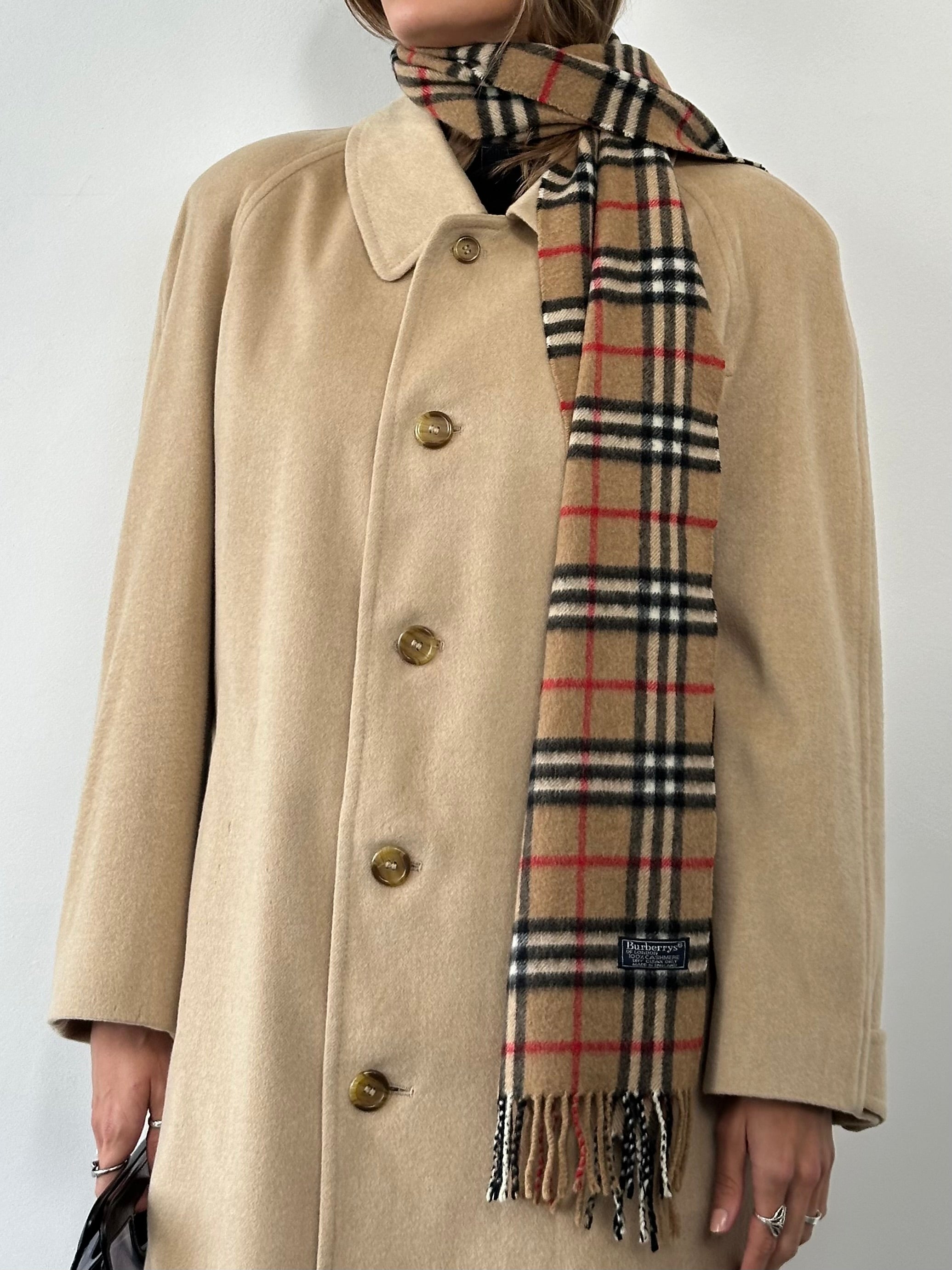 Burberry pure cashmere double-faced single-breasted coat in size large, showcasing classic beige fabric and tailored silhouette.