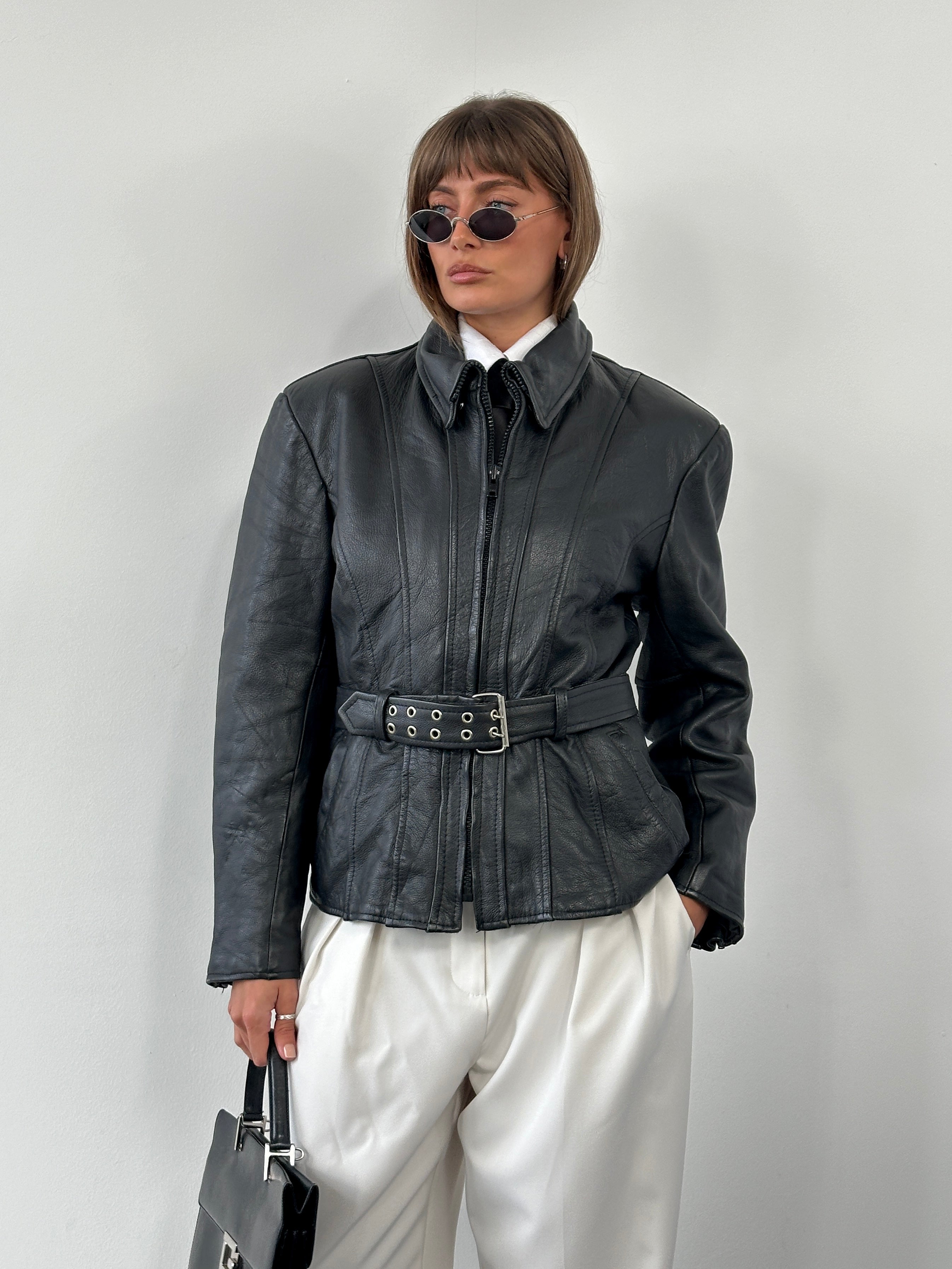 Vintage 1990s high neck belted leather jacket in medium size, featuring classic design and authentic leather texture.