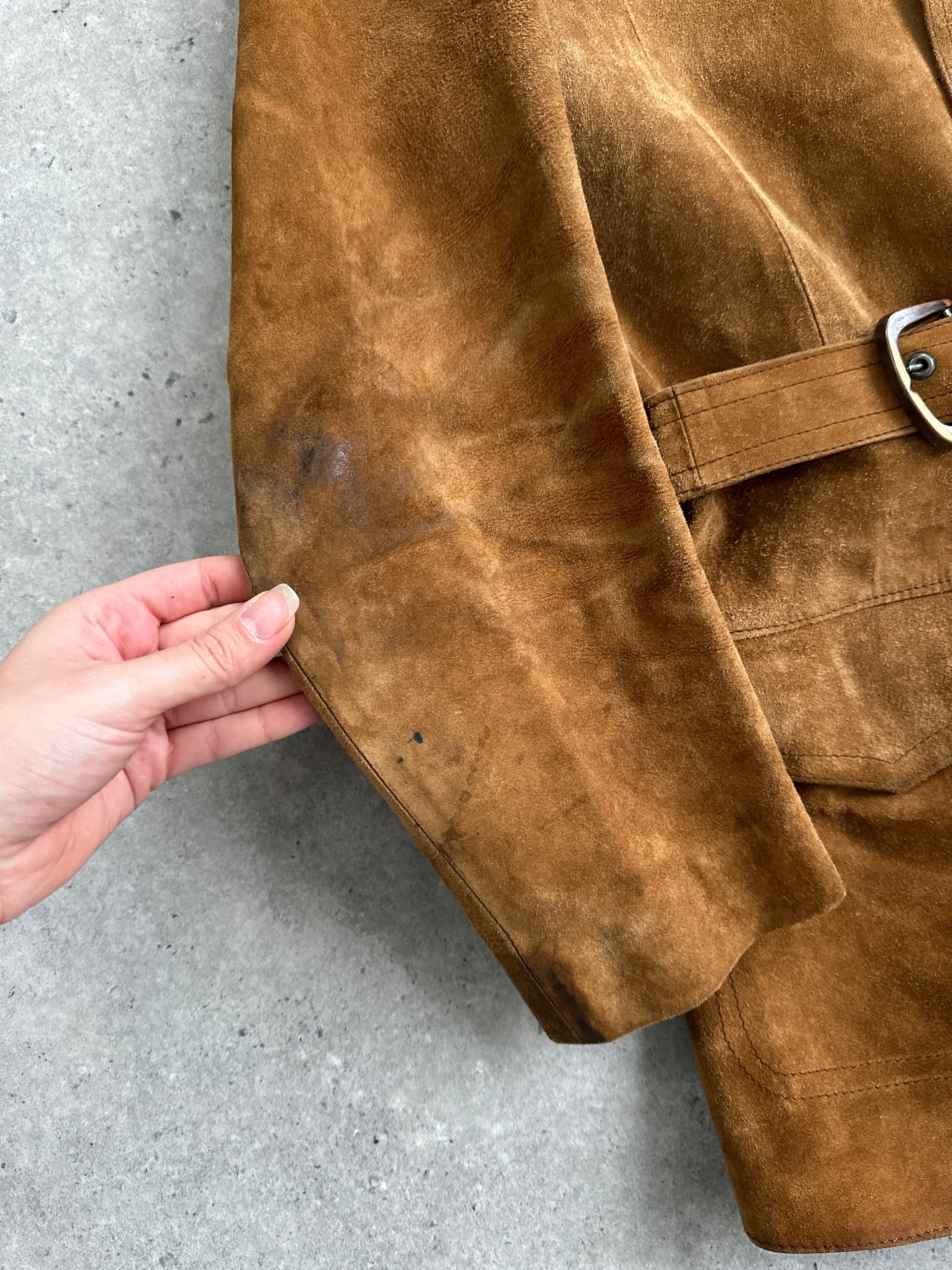 Vintage leather jacket with suede belt and classic design, featuring a structured fit and stylish details.