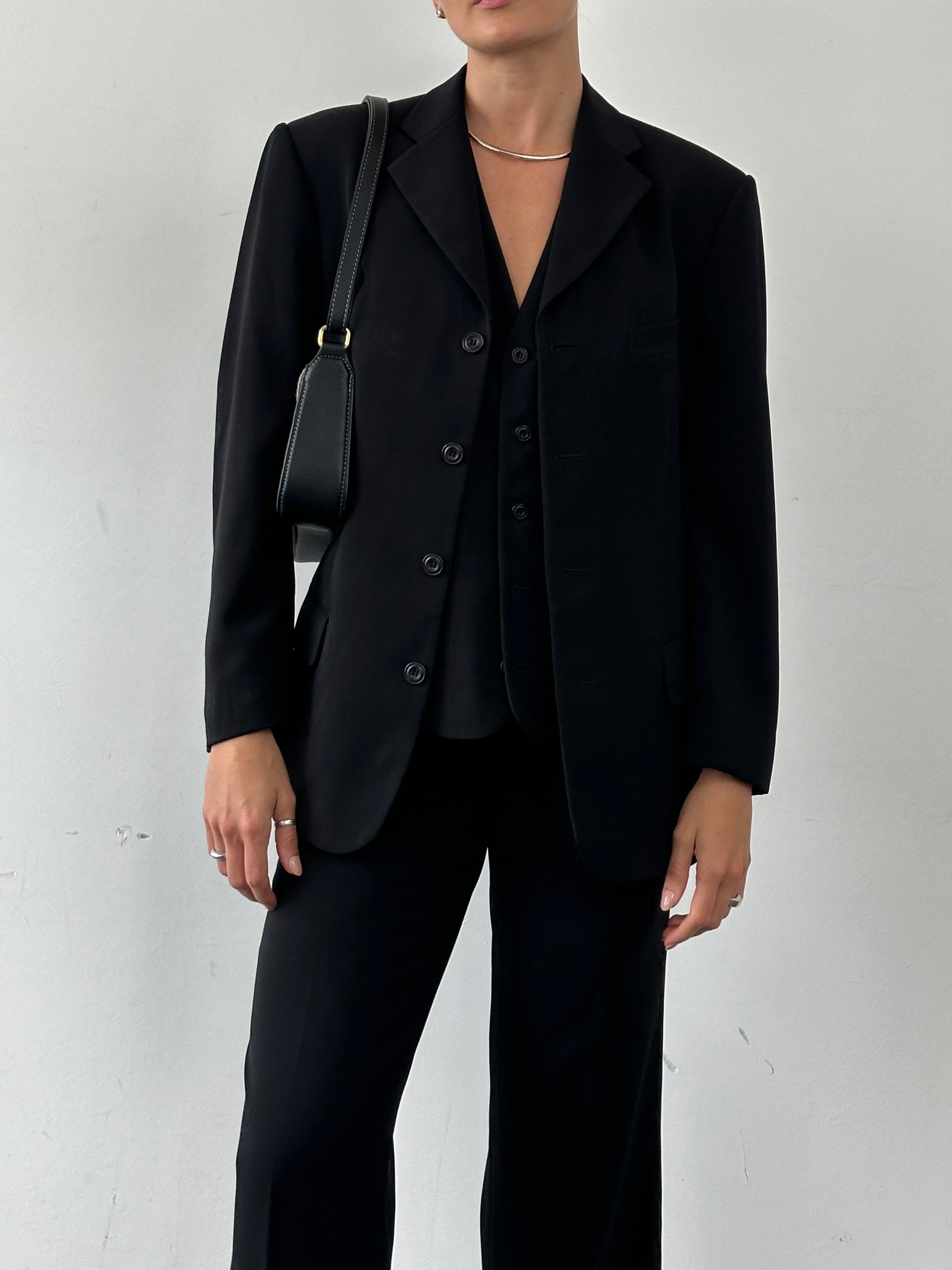 Vintage single breasted three-piece suit in size 36R, featuring tailored jacket, vest, and matching trousers, classic men's formal wear.