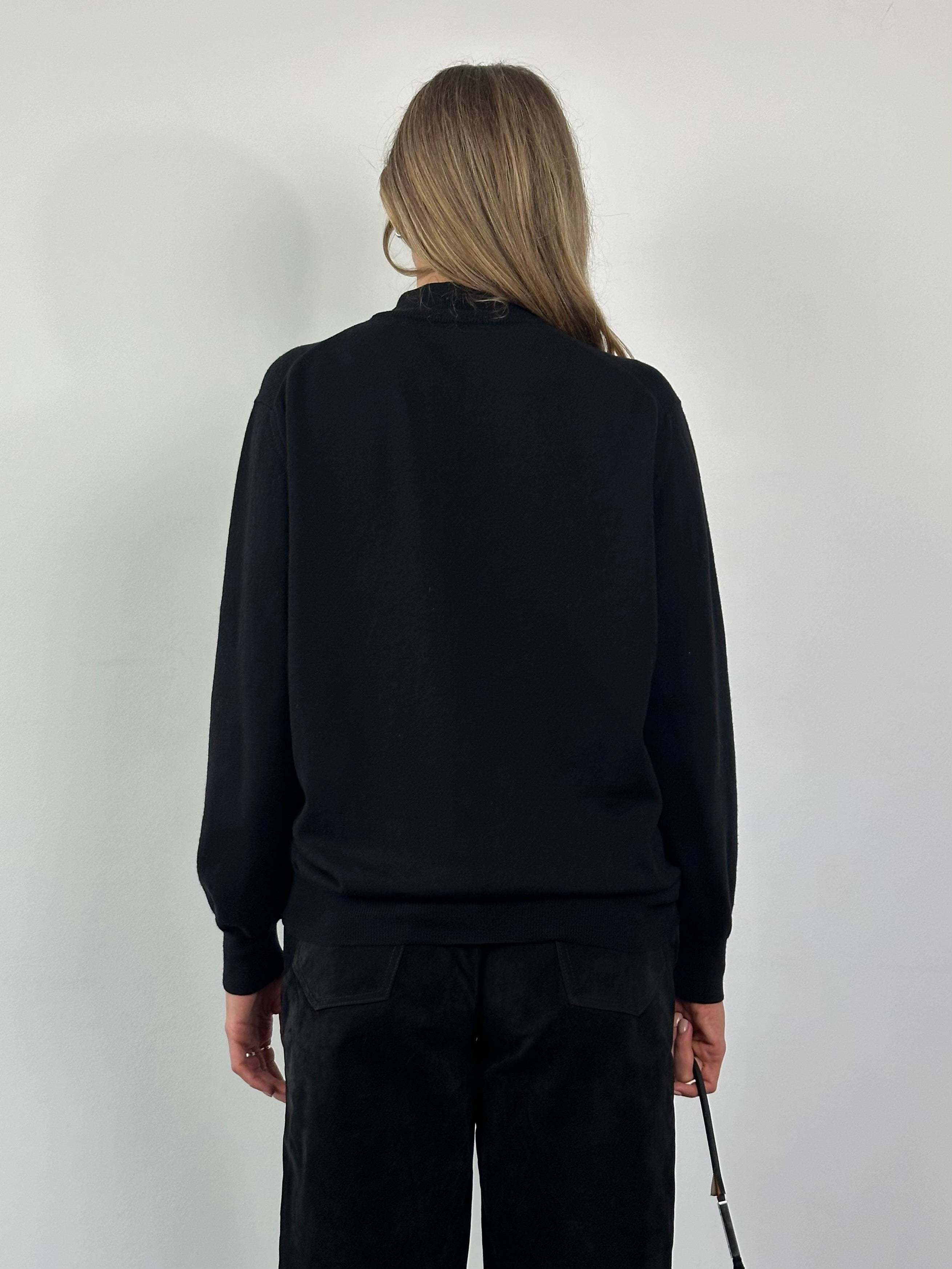 Valentino pure wool logo turtleneck jumper in size M/L, featuring a classic turtleneck design and subtle brand logo detail.