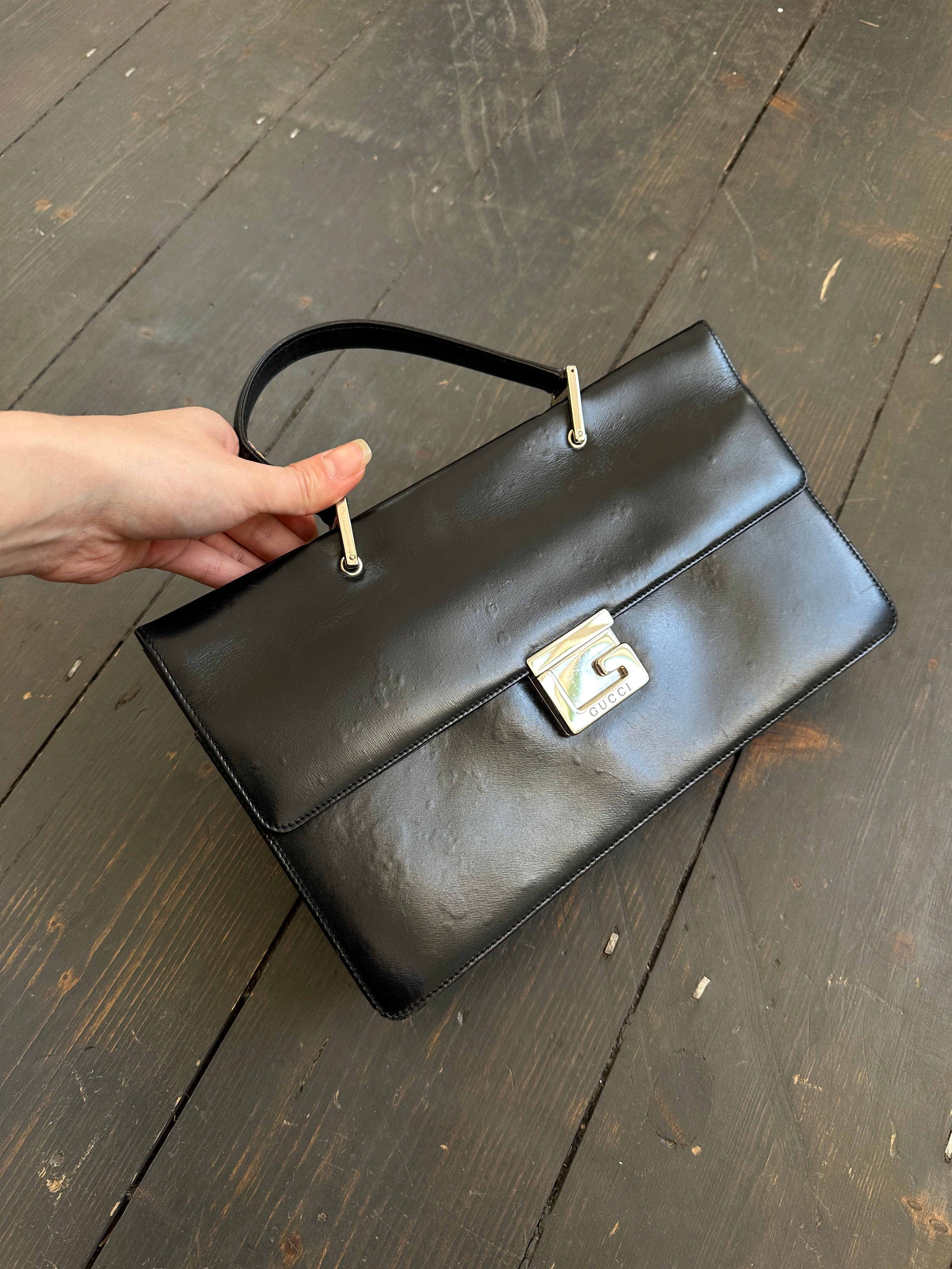 Gucci 1990s Tom Ford square G leather handbag with structured design and gold-tone hardware.