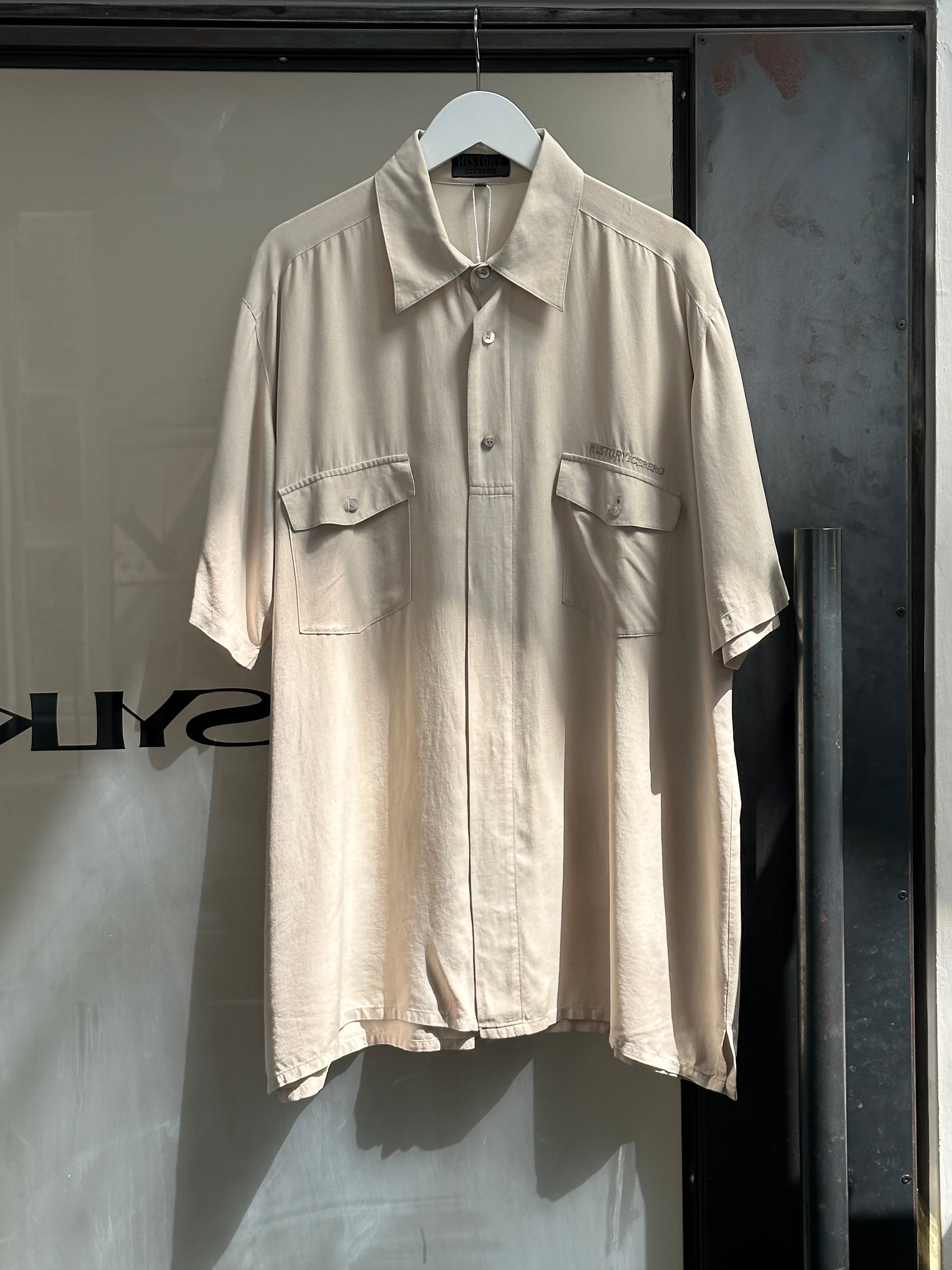 Iceberg 90s pure silk short sleeve shirt in XL with a sleek, smooth fabric and classic design, displayed on a neutral background.