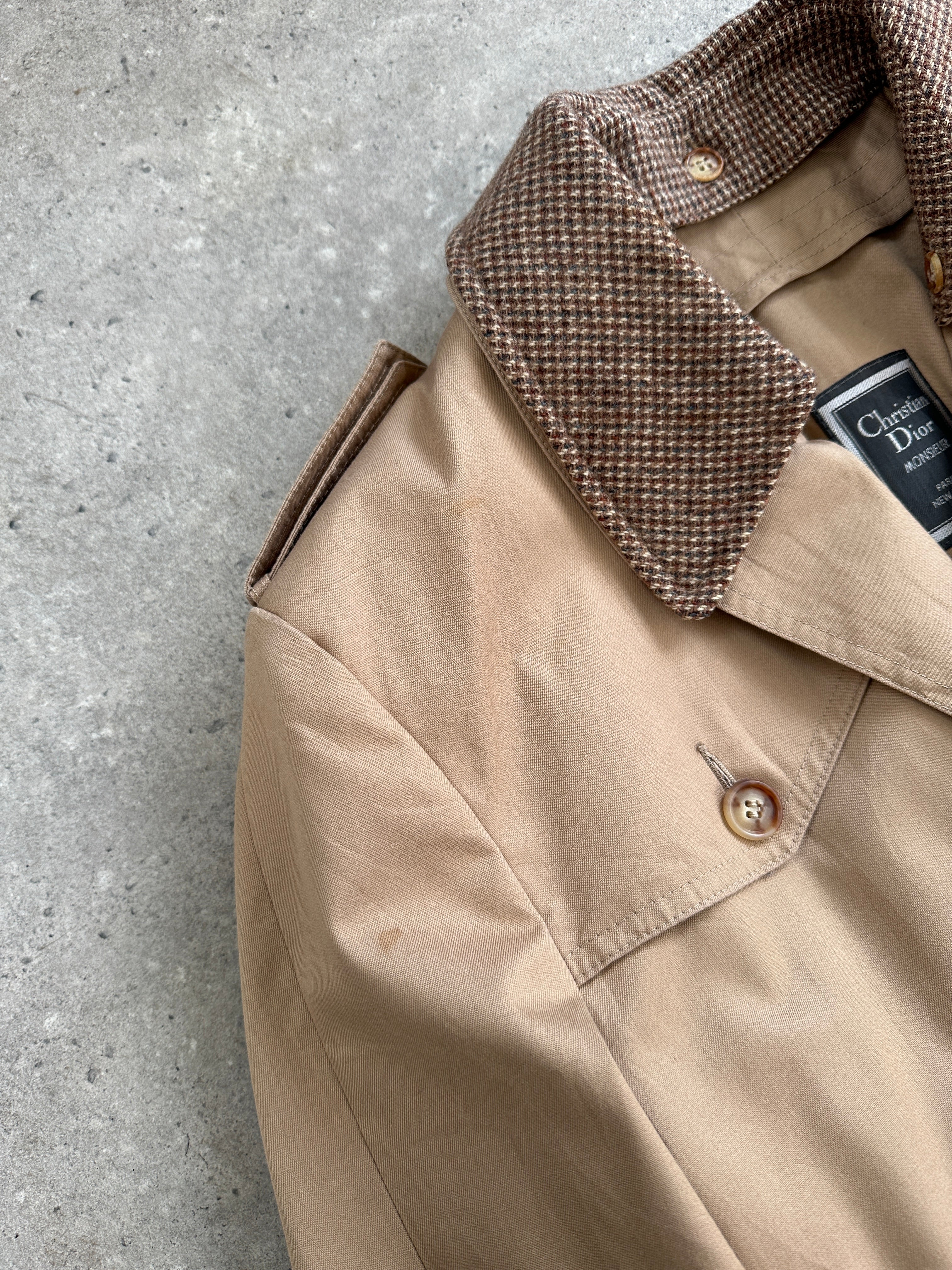 Christian Dior Monsieur cotton trench coat with belted waist, single-breasted design, in a classic beige color.