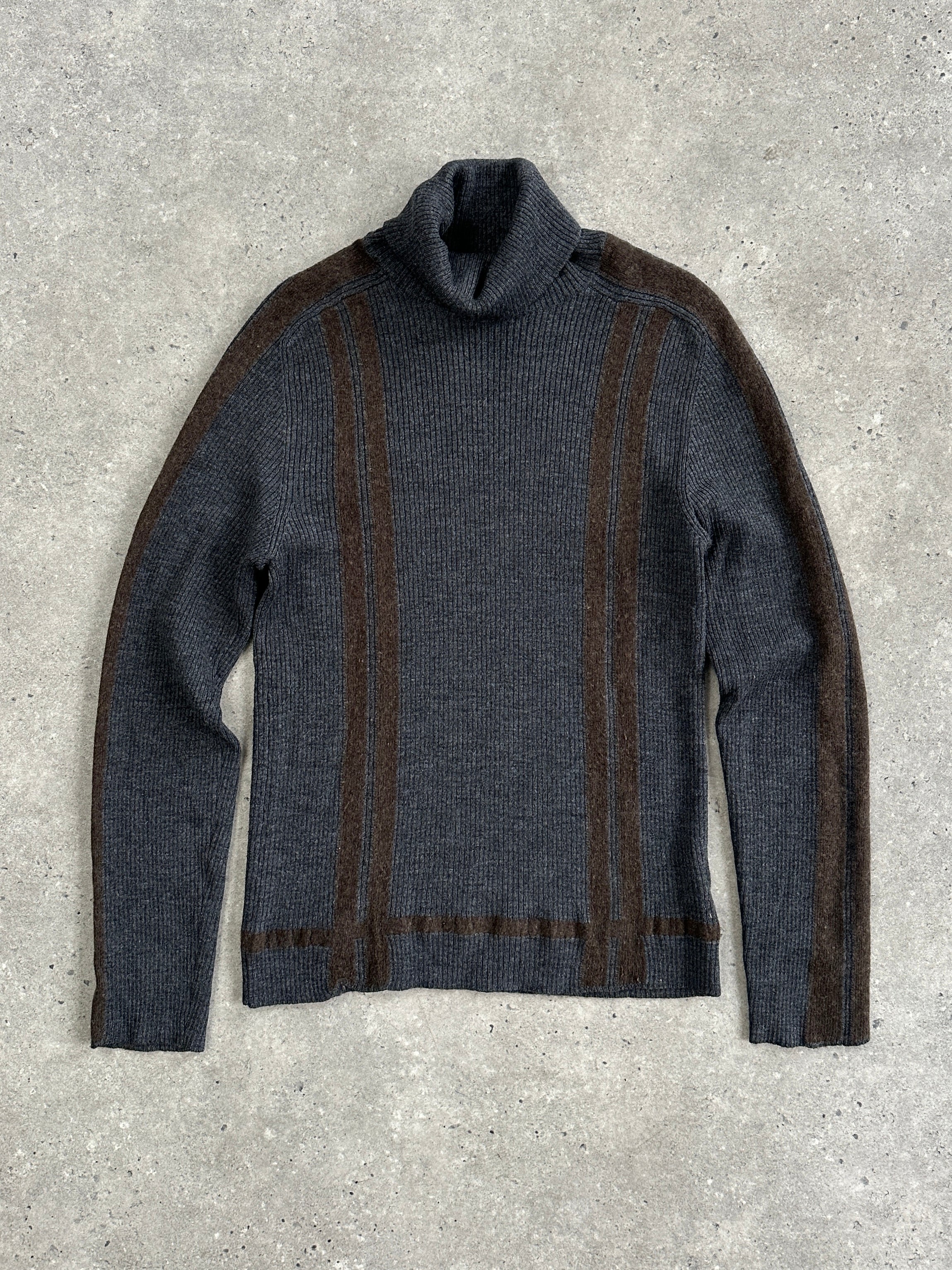 Dolce & Gabbana wool rib-knit turtle neck jumper in black, featuring a close-up view of the textured fabric and high neckline.