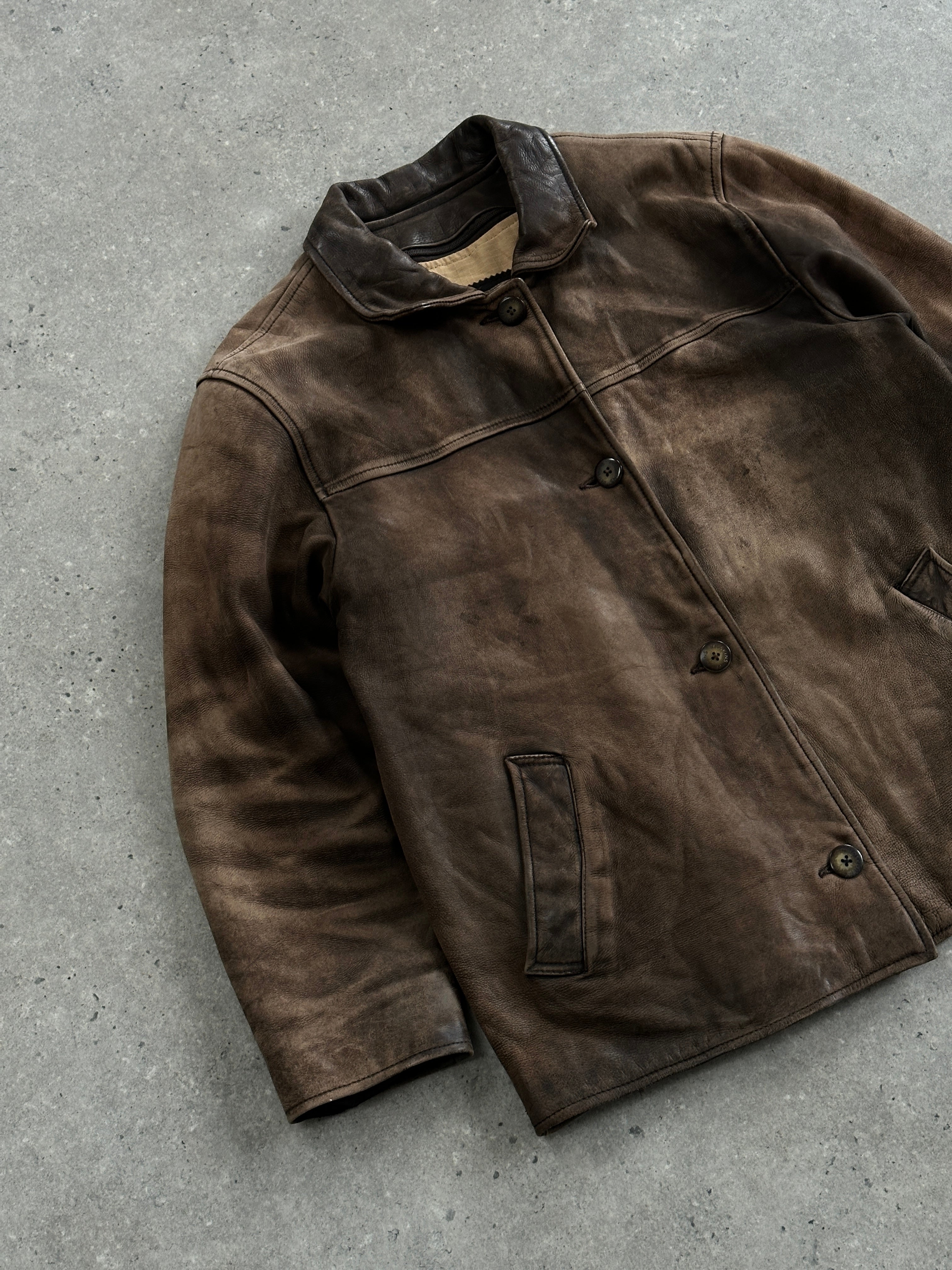 Vintage 1990s distressed leather jacket, size M, featuring rugged texture and classic style, from the Vintage brand.
