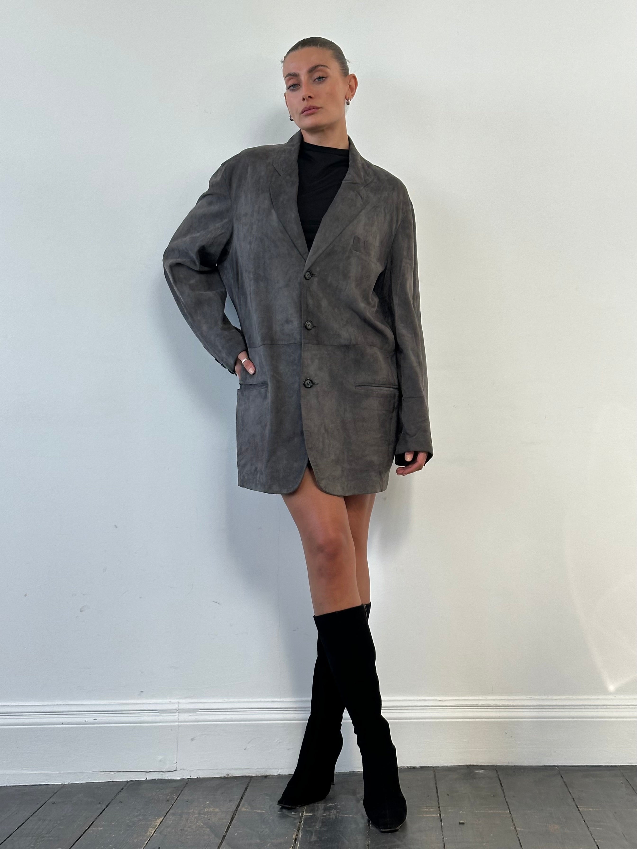 Giorgio Armani Black Label suede blazer jacket in size L, tailored fit with classic lapel and sleek design, displayed on a hanger.
