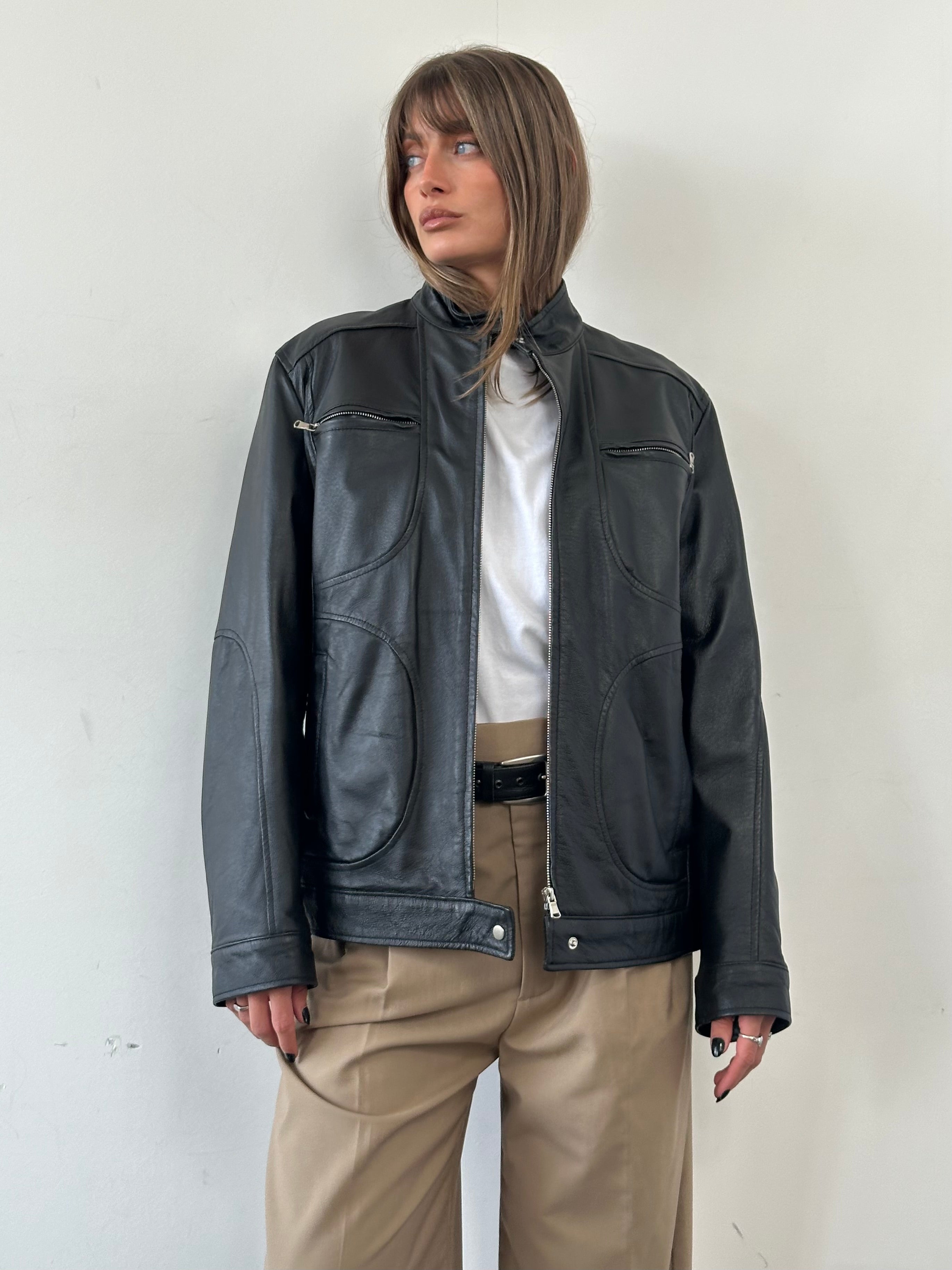 Vintage Moto Leather Jacket in size M/L, featuring classic design, zip details, and distressed brown leather for a stylish, rugged look.