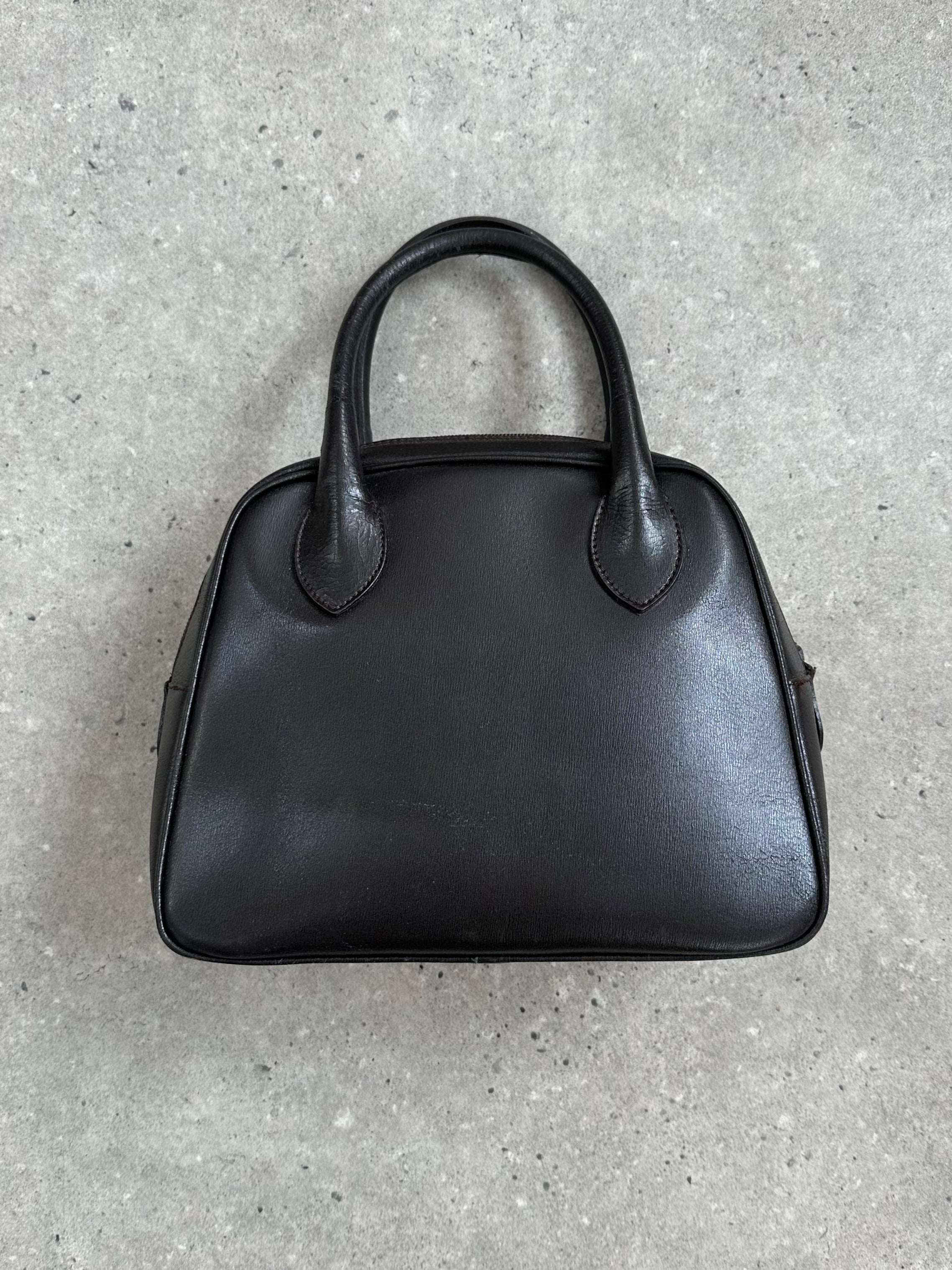 Emporio Armani leather handbag from the 2000s featuring a sleek design and classic style, with visible craftsmanship and elegant detailing.