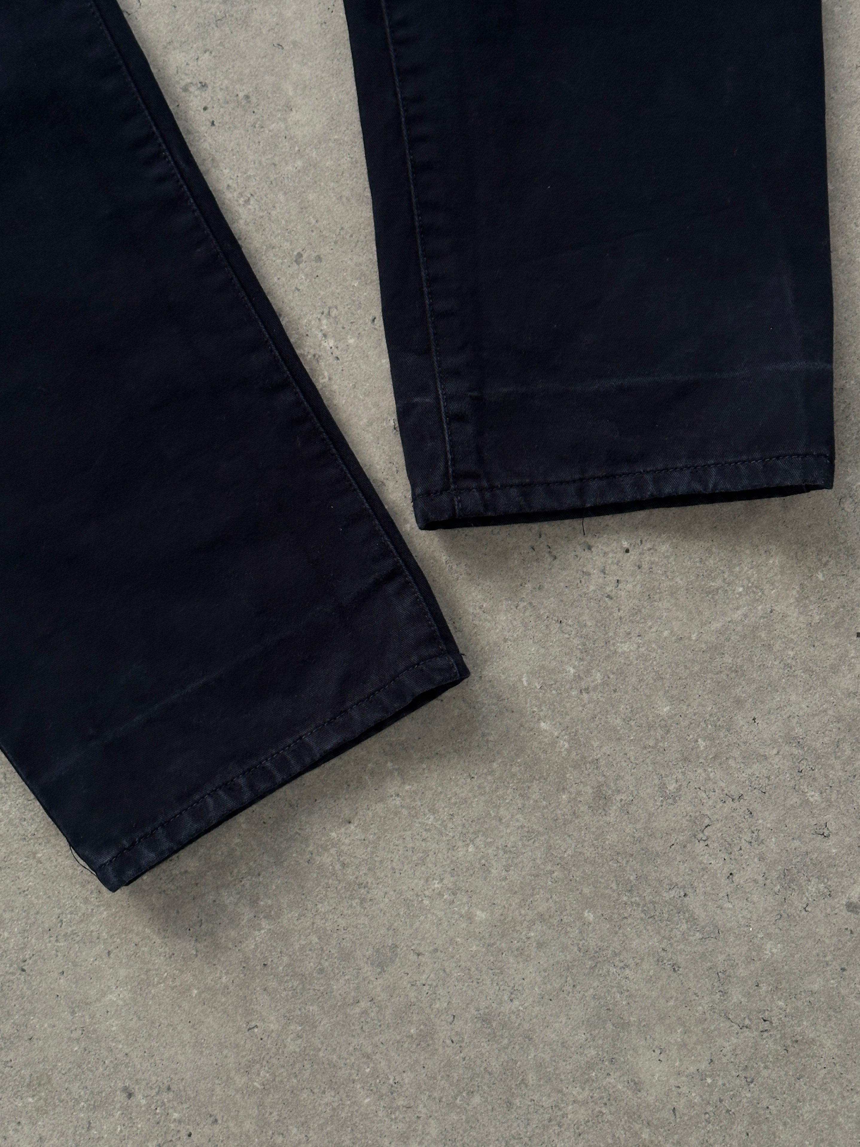 Versace tall pure cotton tapered leg denim jeans in size W34, featuring classic blue wash and stitching details.