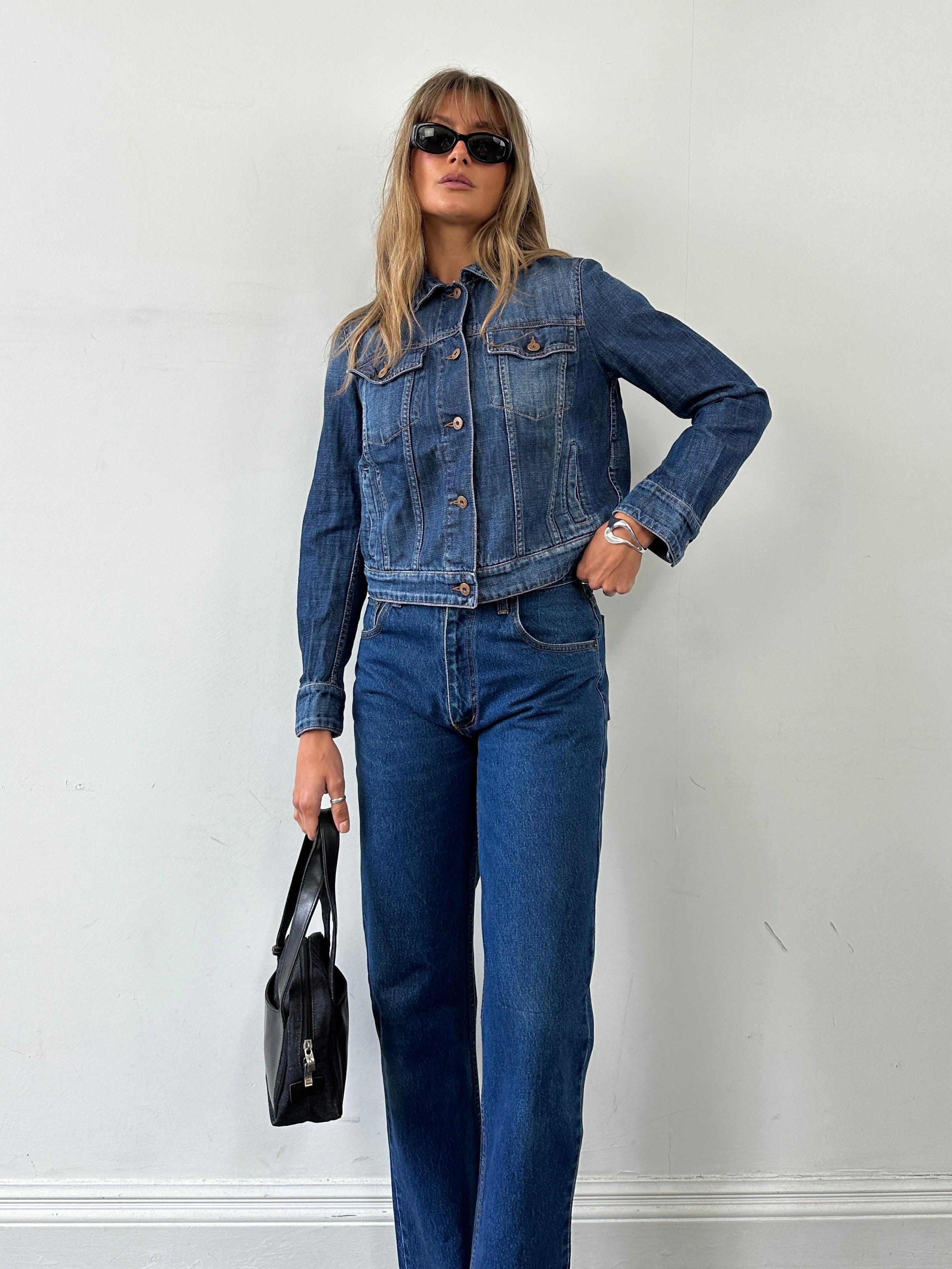 Vintage pure cotton straight leg denim jeans in size W28, featuring classic blue wash and traditional stitching.