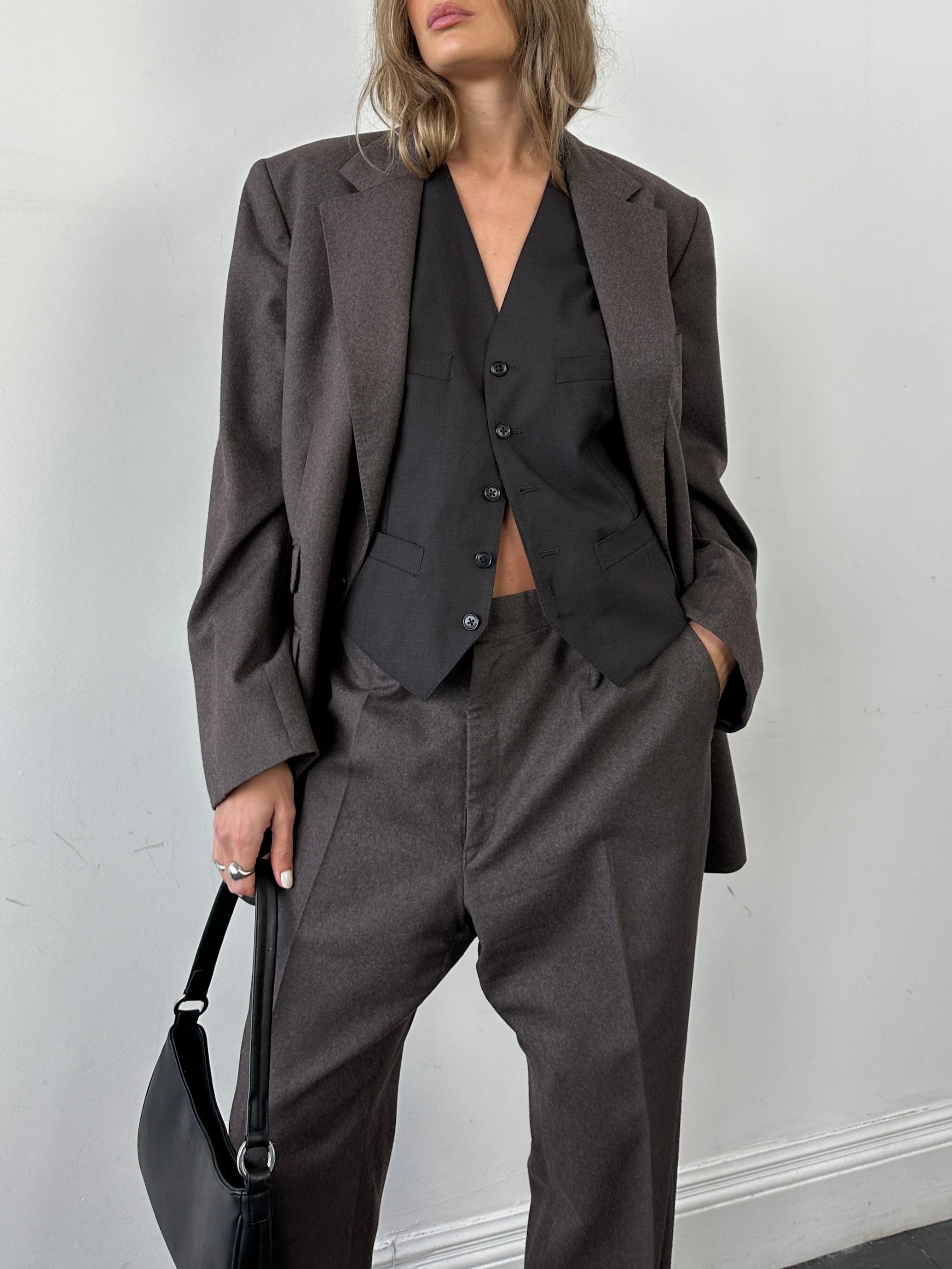 Christian Dior pure wool jumpsuit in size 46R/W34, tailored fit with classic design, shown on a mannequin.
