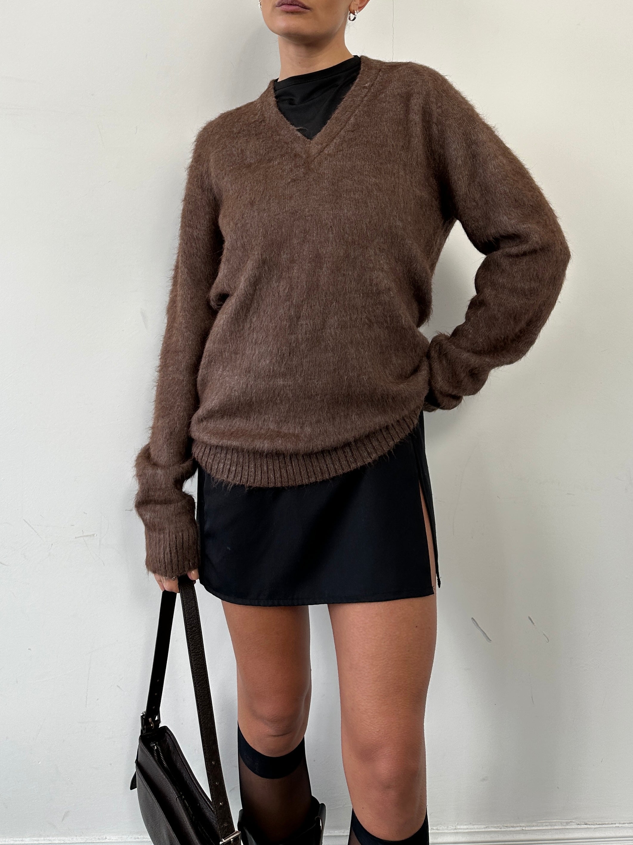 Vintage Italian alpaca V-neck jumper in size M/L, featuring a cozy, textured knit and classic design.