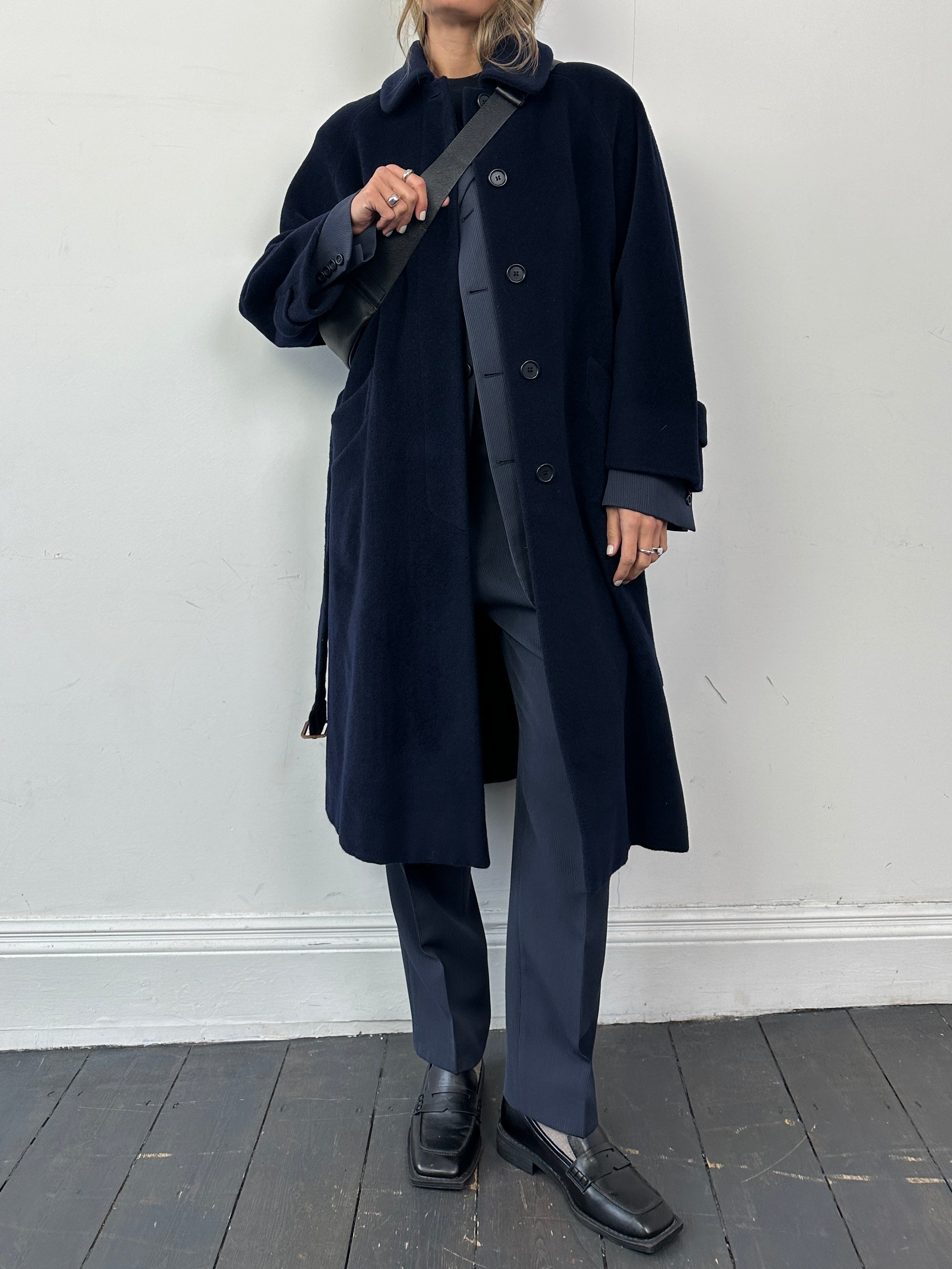 Vintage wool belted coat with concealed placket, single-breasted design, in size L, featuring a classic and timeless look.