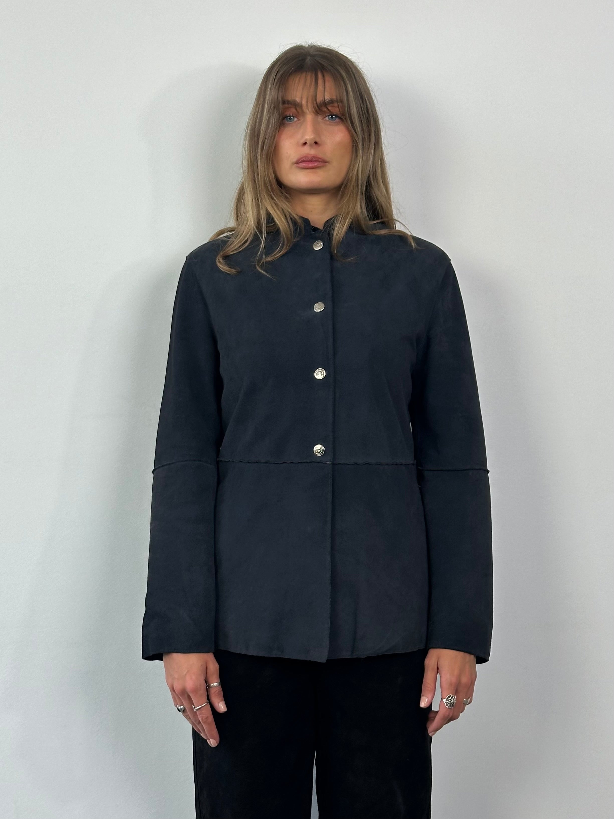 Armani Jeans fitted suede jacket in size M, shown in a close-up image highlighting the soft leather texture and tailored fit.