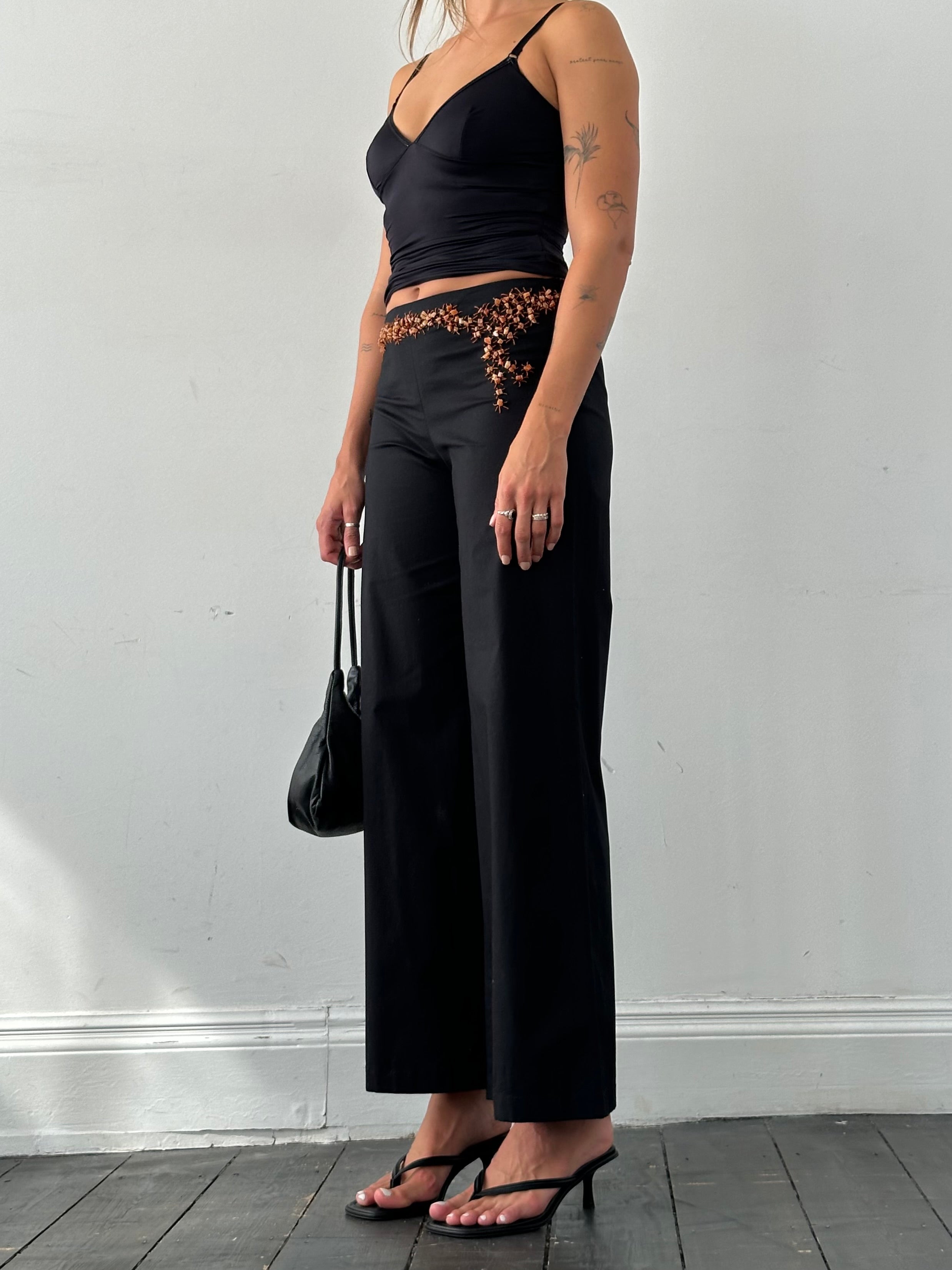 Vintage Alberta Ferretti mid waist wide-leg stone-embellished trousers, front view showcasing embellished details and relaxed fit.