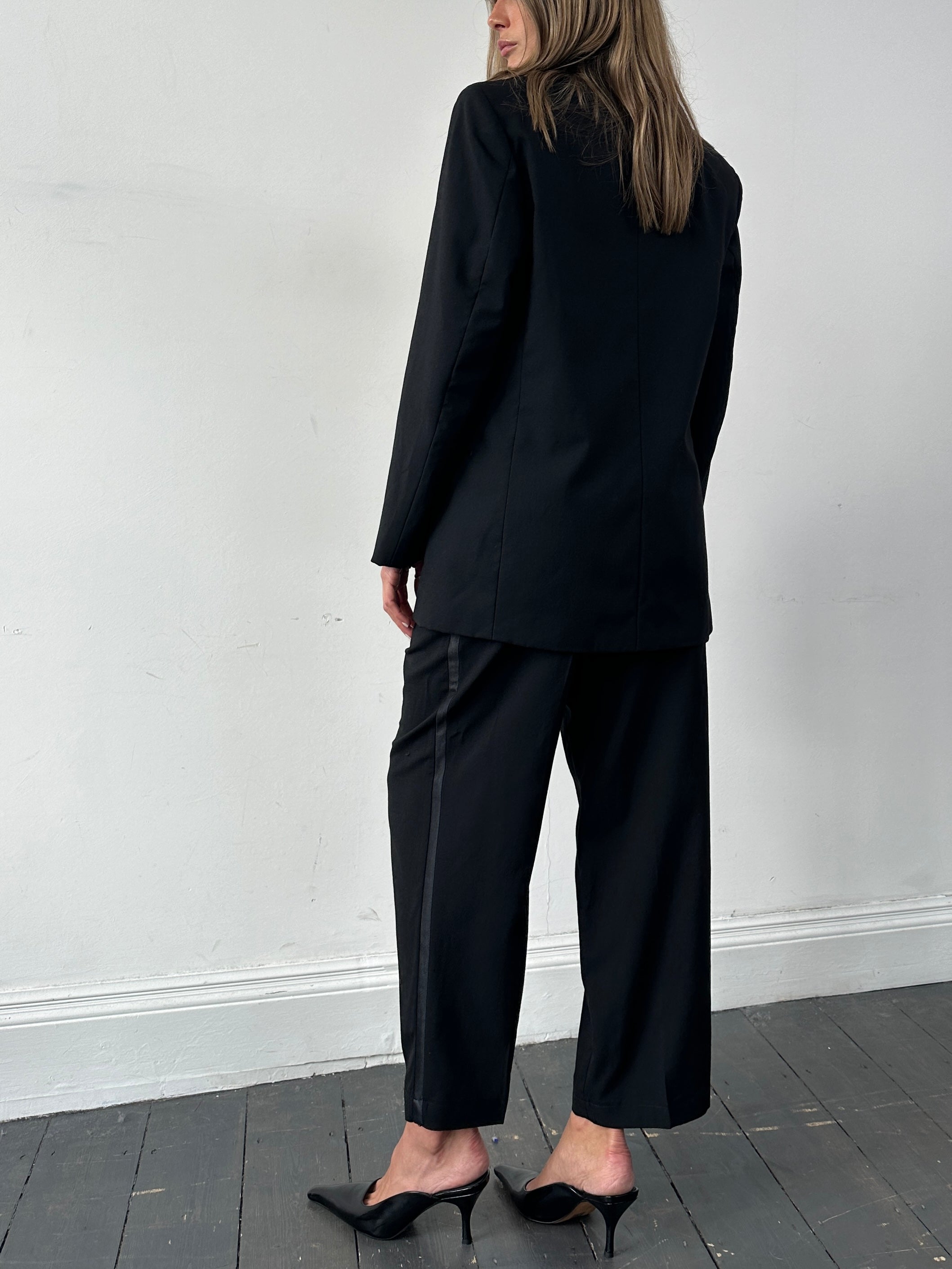 Vintage brand vintage tuxedo jumpsuit in pure wool, double-breasted design, size 38R/W26-32, shown in a classic black style.