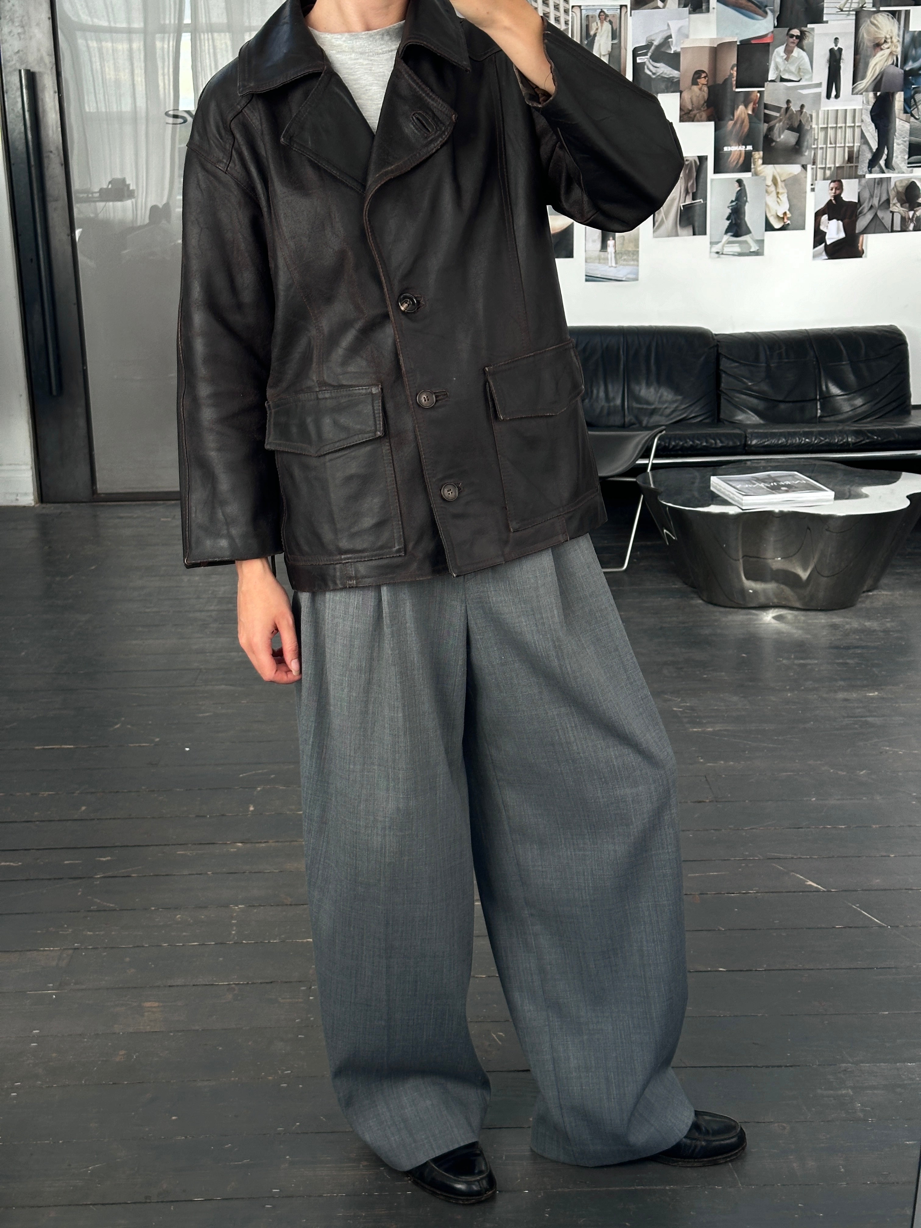 Vintage Italian 1980s belted leather jacket, size M, featuring classic design and aged leather aesthetic.