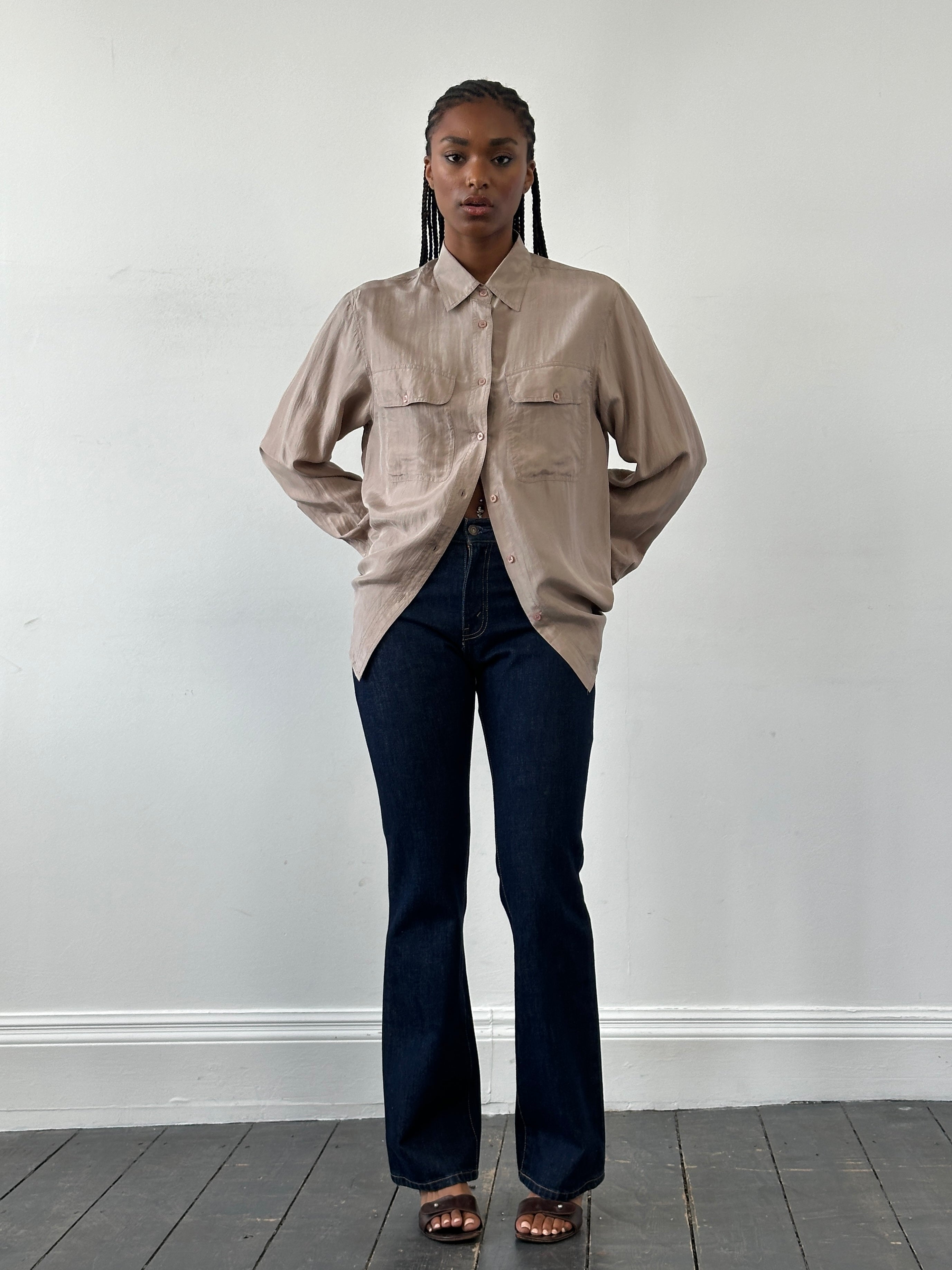 Levi’s 525 mid-rise denim bootcut jeans in W26, showing classic blue wash, zipper fly, and five-pocket design.
