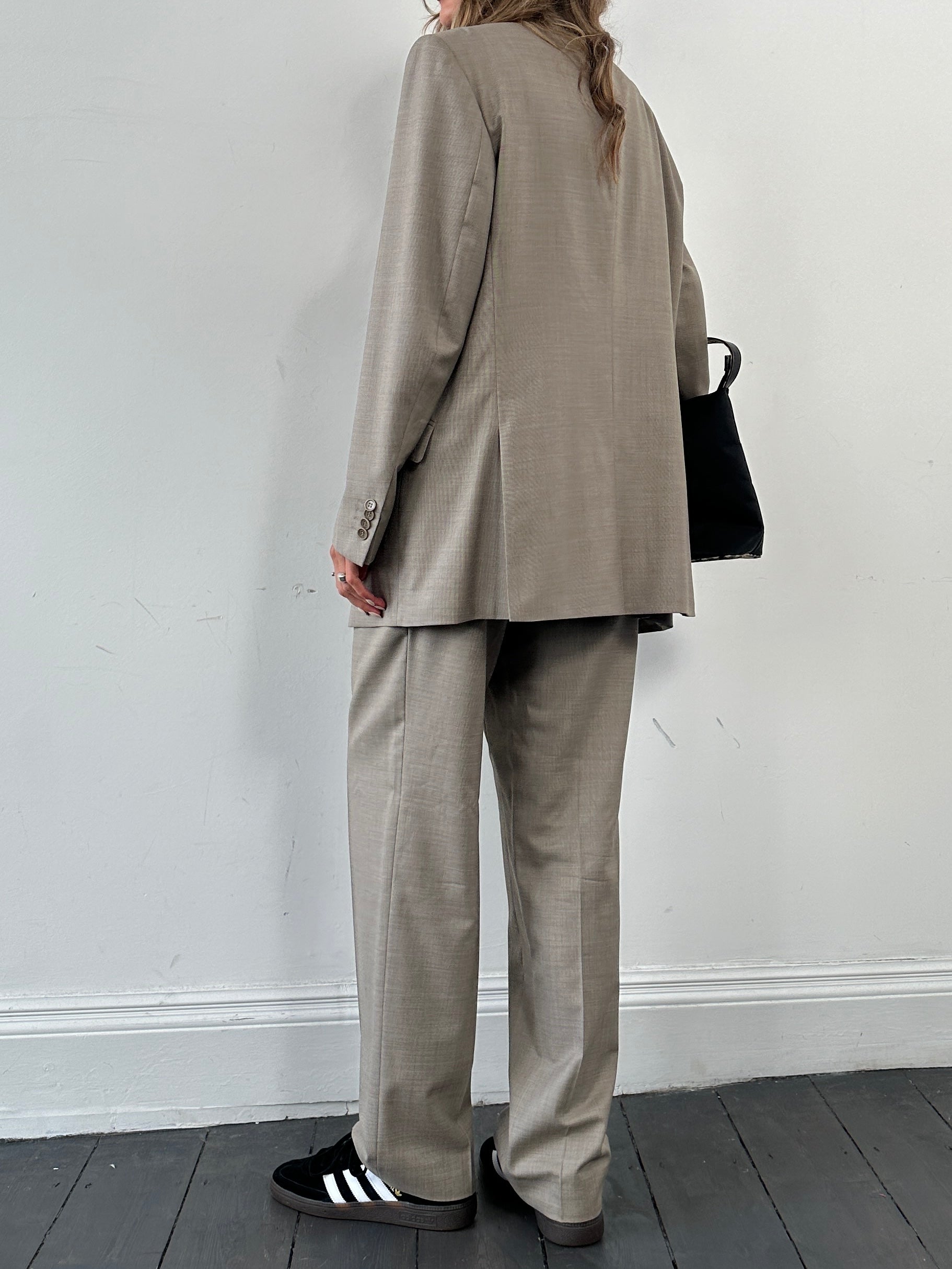 Balmain Homme wool silk single-breasted jumpsuit in size 42R/W34, featuring tailored fit and elegant fabric details.