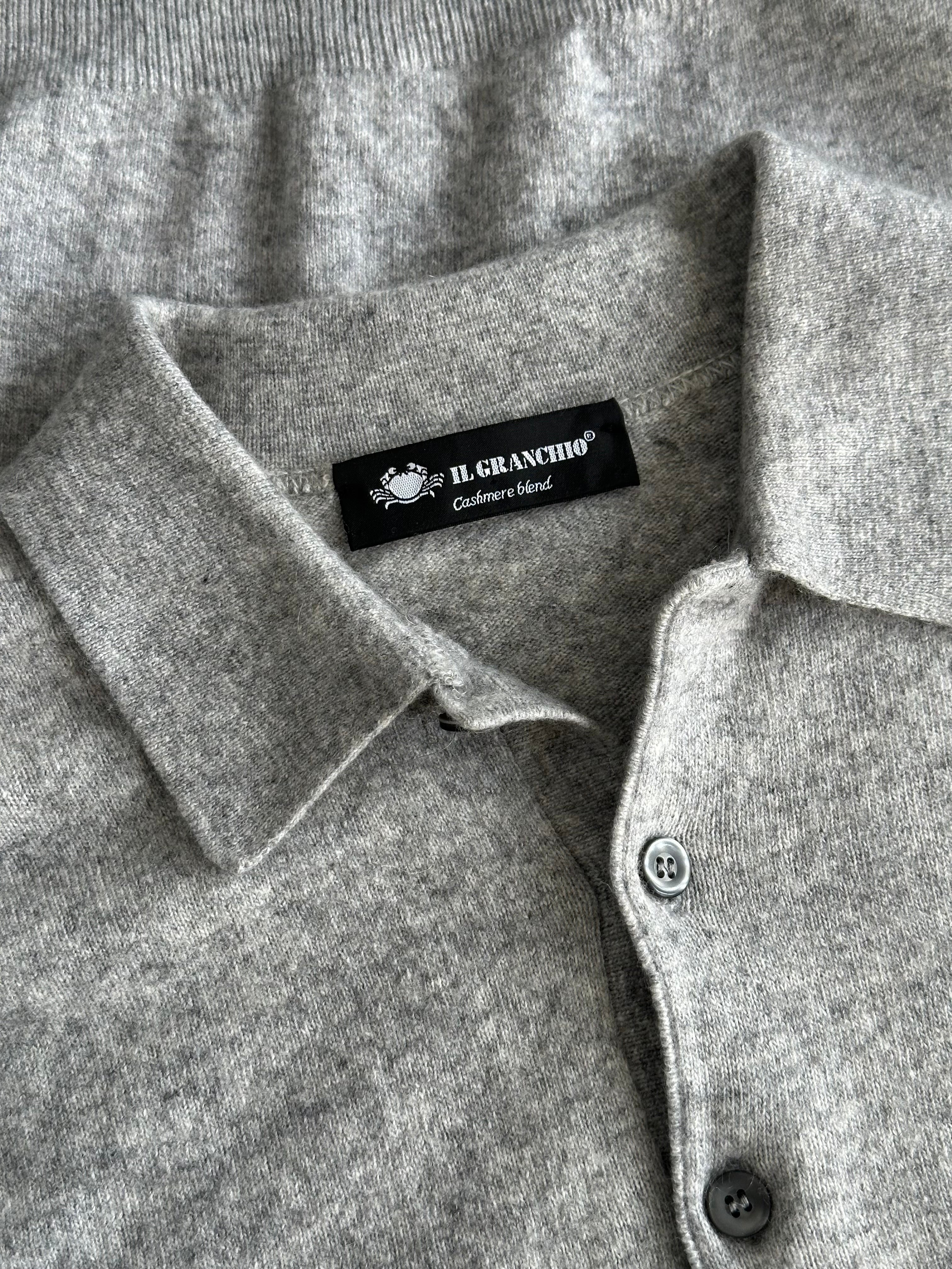 Vintage brand vintage merino wool cashmere polo jumper in size M, showing a close-up of the soft, knitted fabric and classic collar.