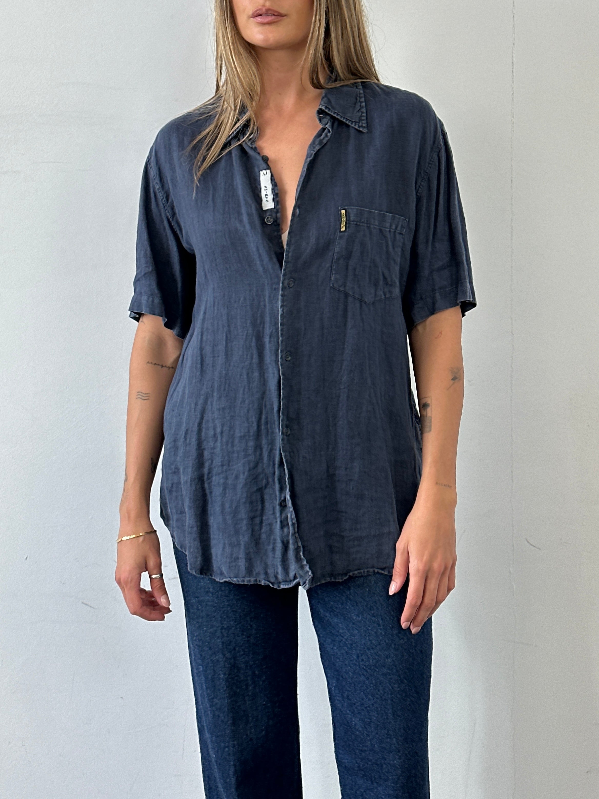 Armani Jeans pure linen short sleeve shirt in size L, featuring a classic fit and stylish design, displayed on a hanger.