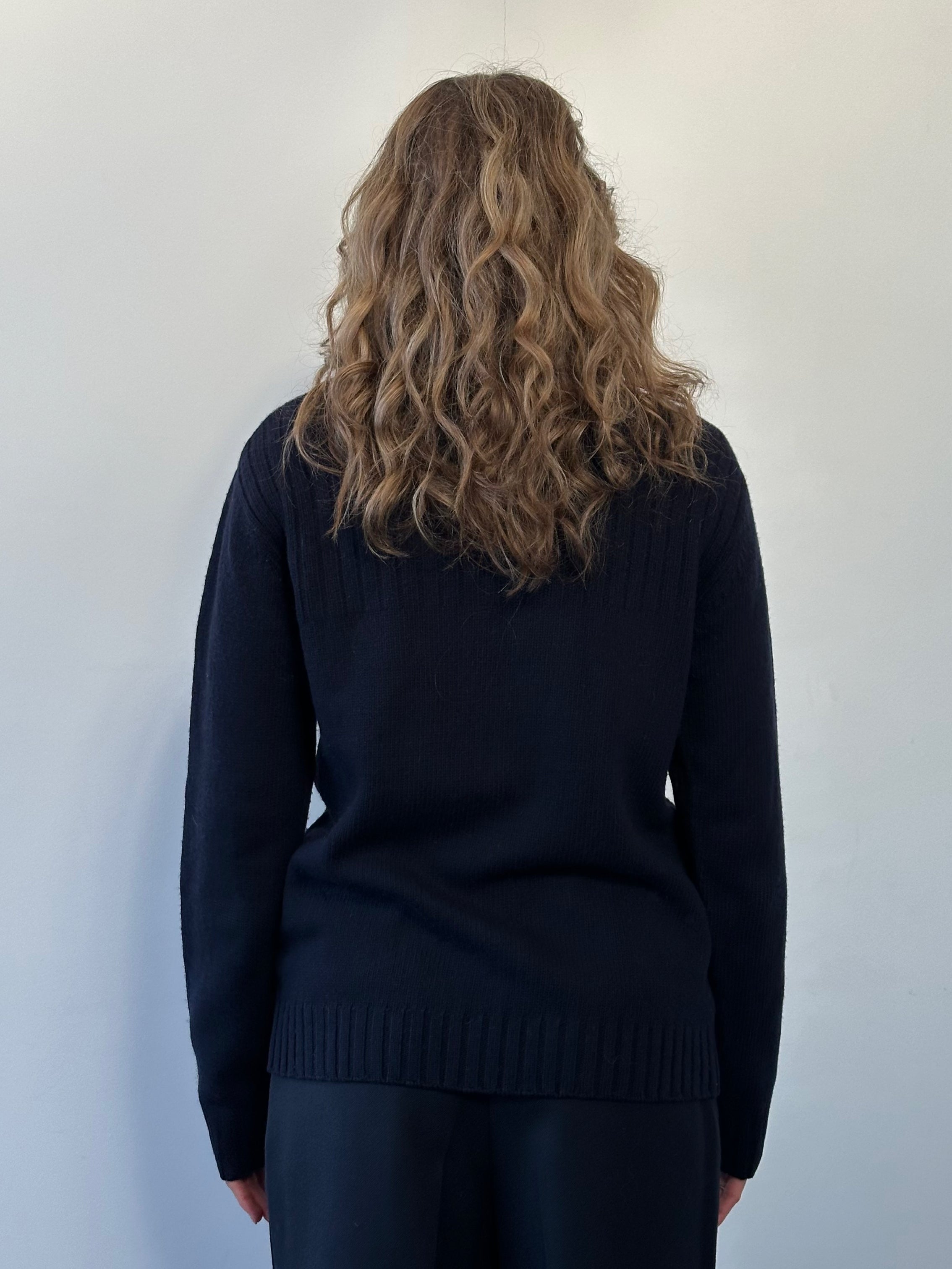 Barbour Pure Wool Roll Neck Jumper in size M, soft wool knit, showcasing the classic fitted roll neck design and textured fabric.