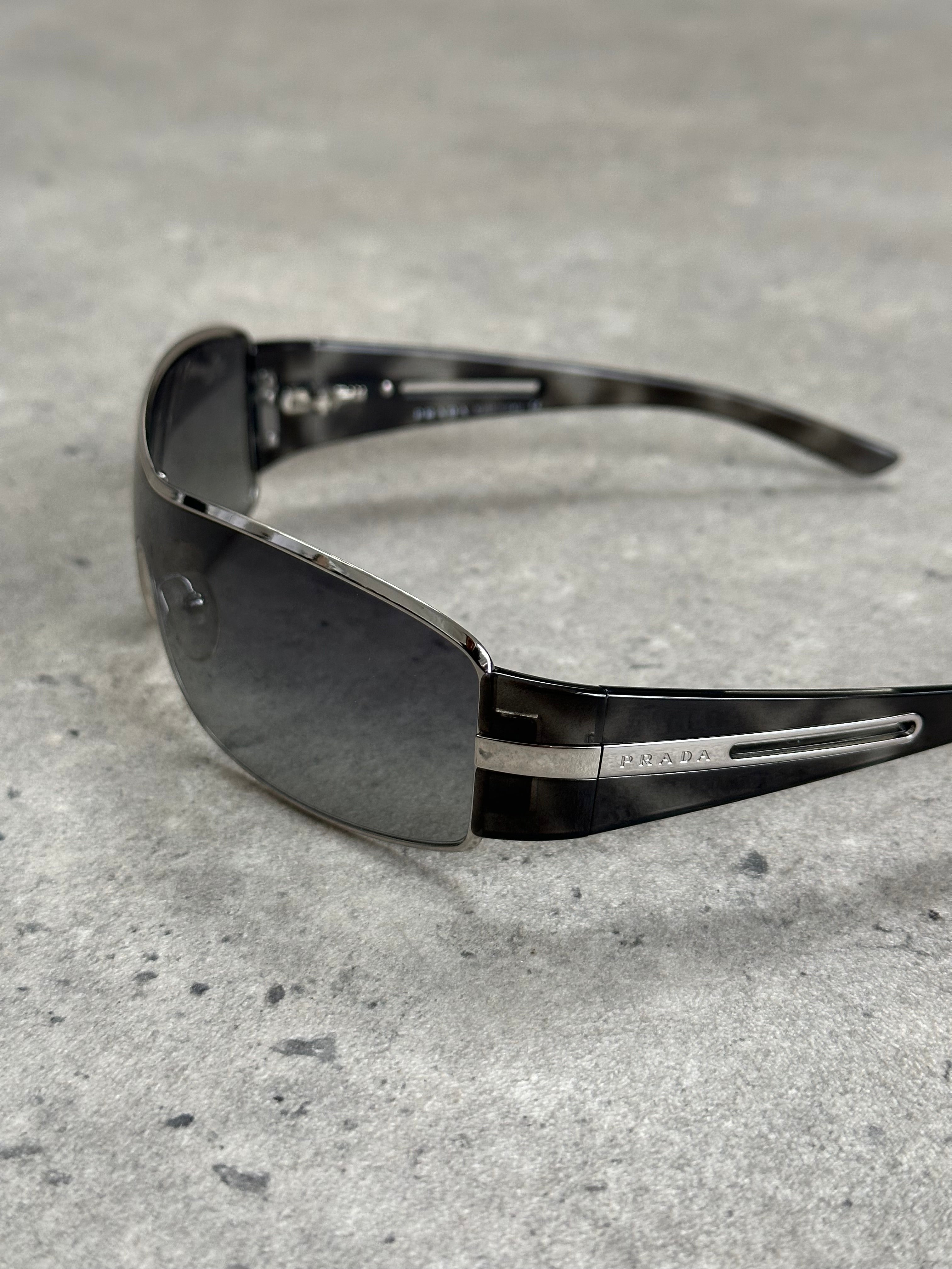 Prada 2000s aviator shield sunglasses with dark tinted lenses and metallic frame, stylish and iconic eyewear.