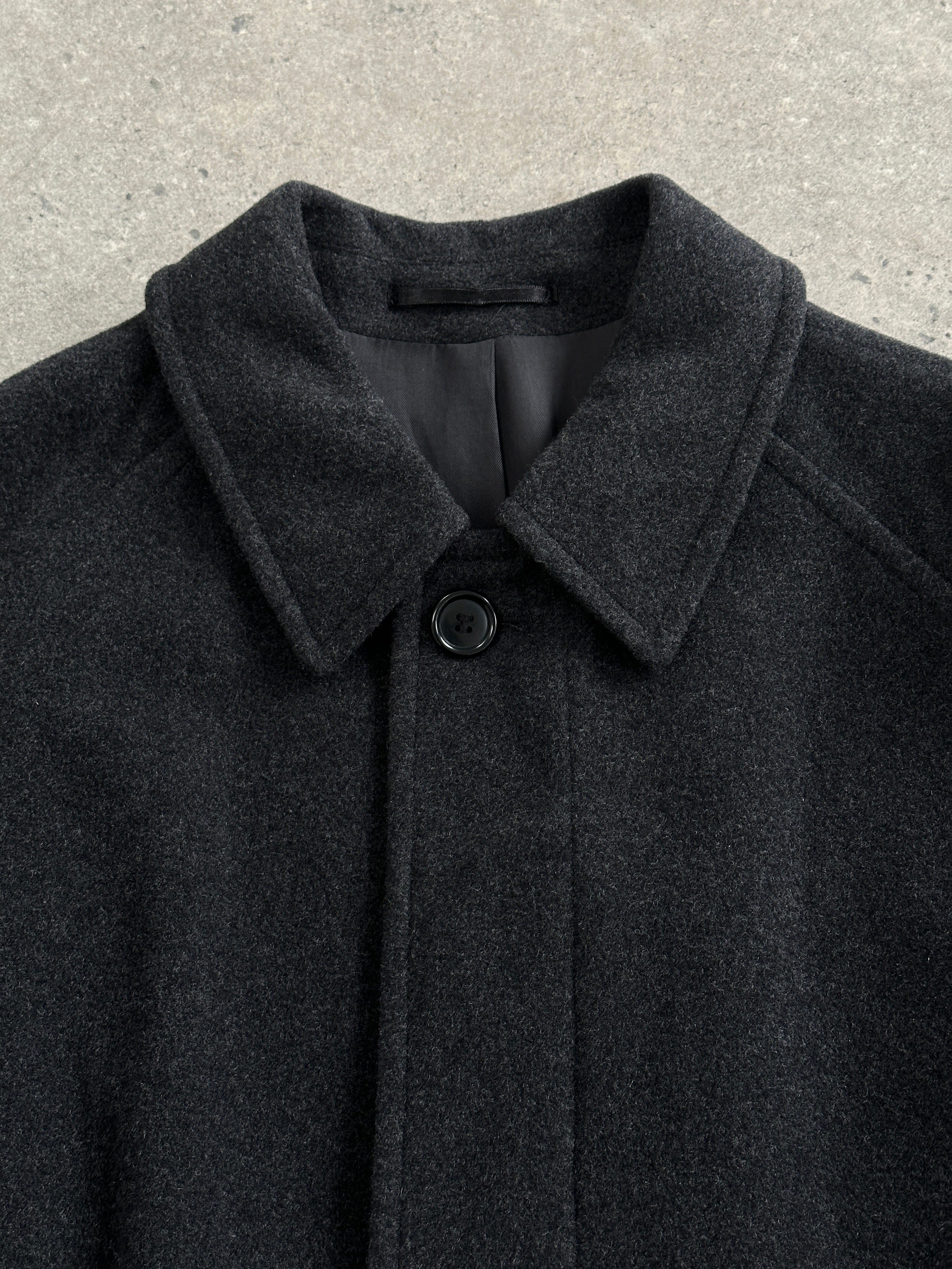 Vintage 1990s wool cashmere belted coat in size L/XL, classic style with a tailored fit and warm, luxurious fabric.