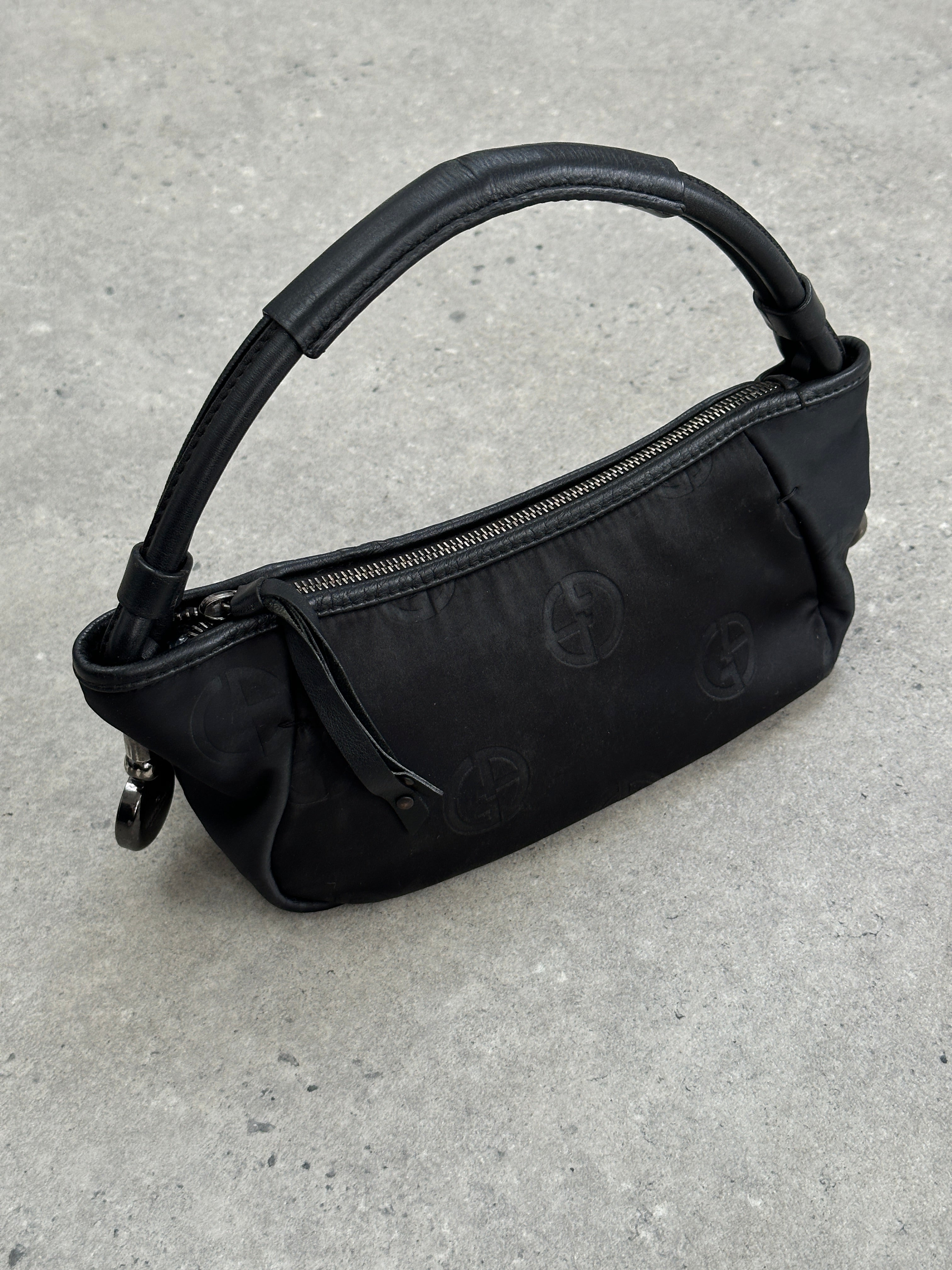 Giorgio Armani 2000s GA Monogram Baguette Bag with signature logo pattern and sleek design, featuring a rectangular shape and elegant detailing.