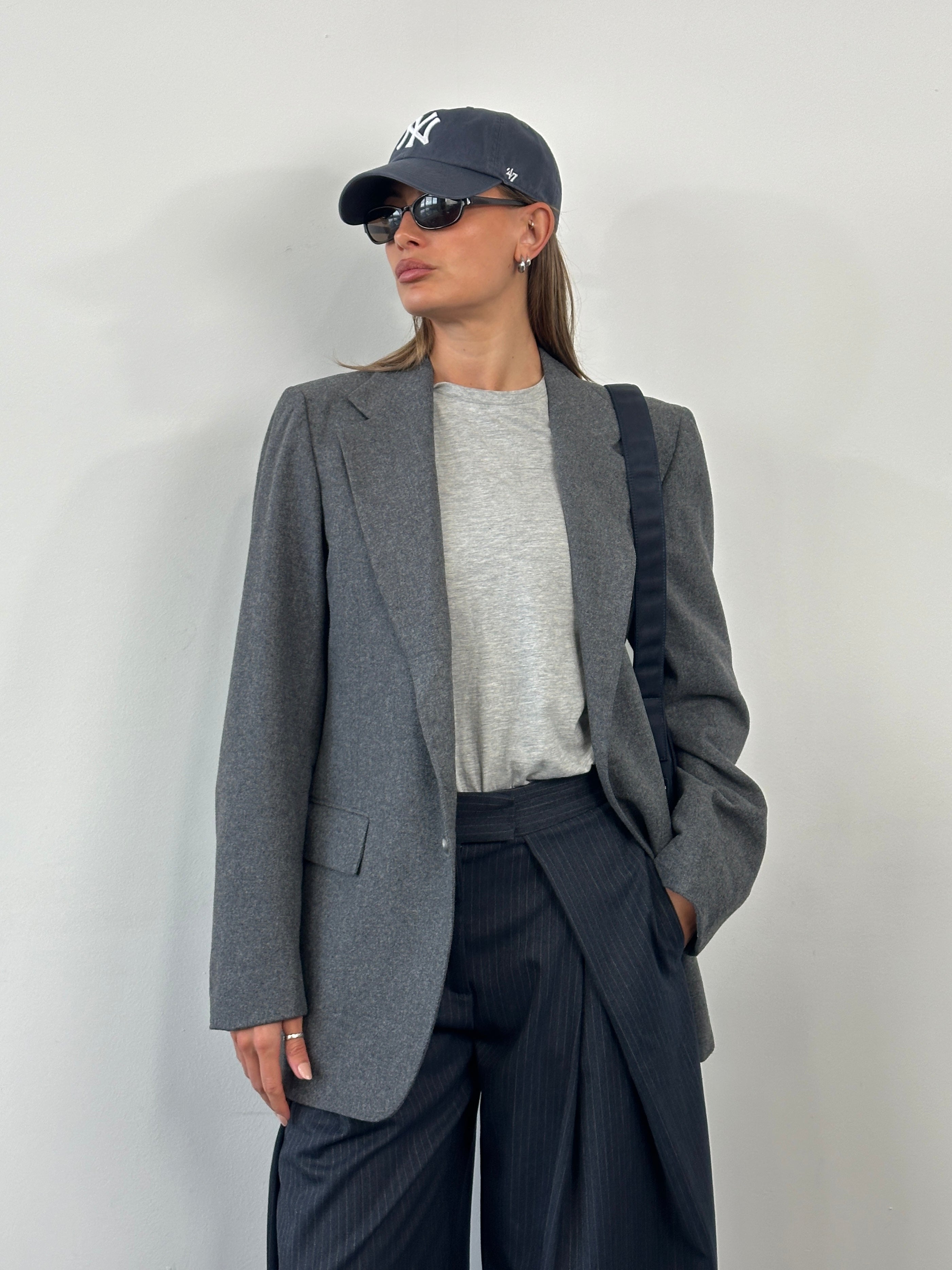 Yves Saint Laurent 1990s single-breasted brushed wool blazer in size 38R/L, shown in classic tailored style with lapels.