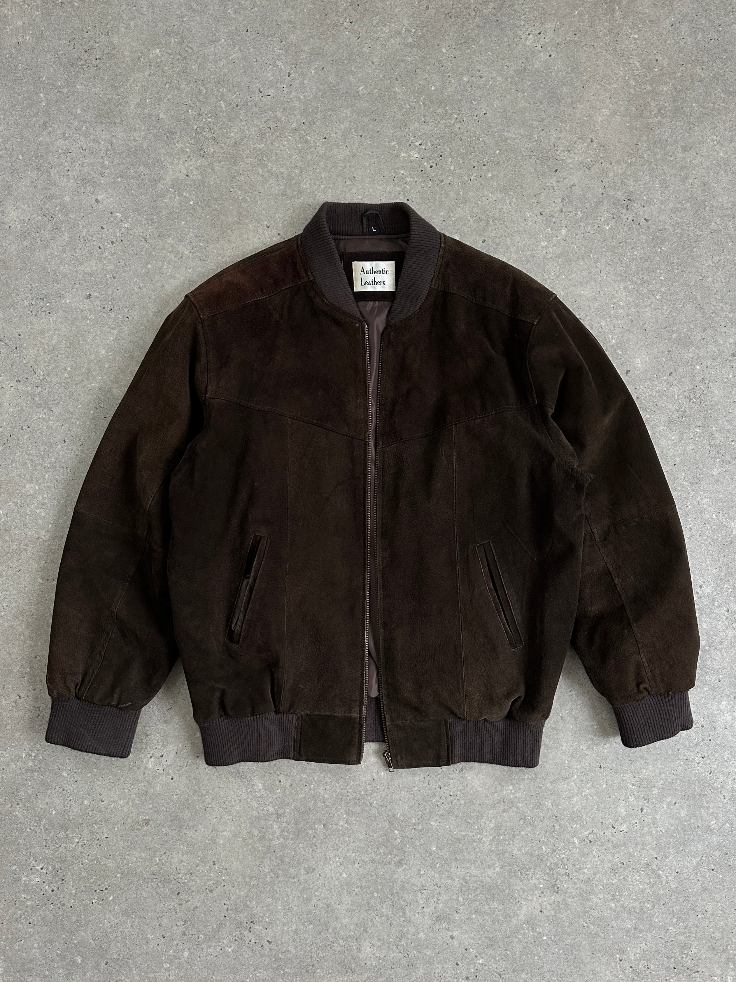 Vintage leather bomber jacket in suede, size large, with classic design and textured finish, styled for a vintage look.