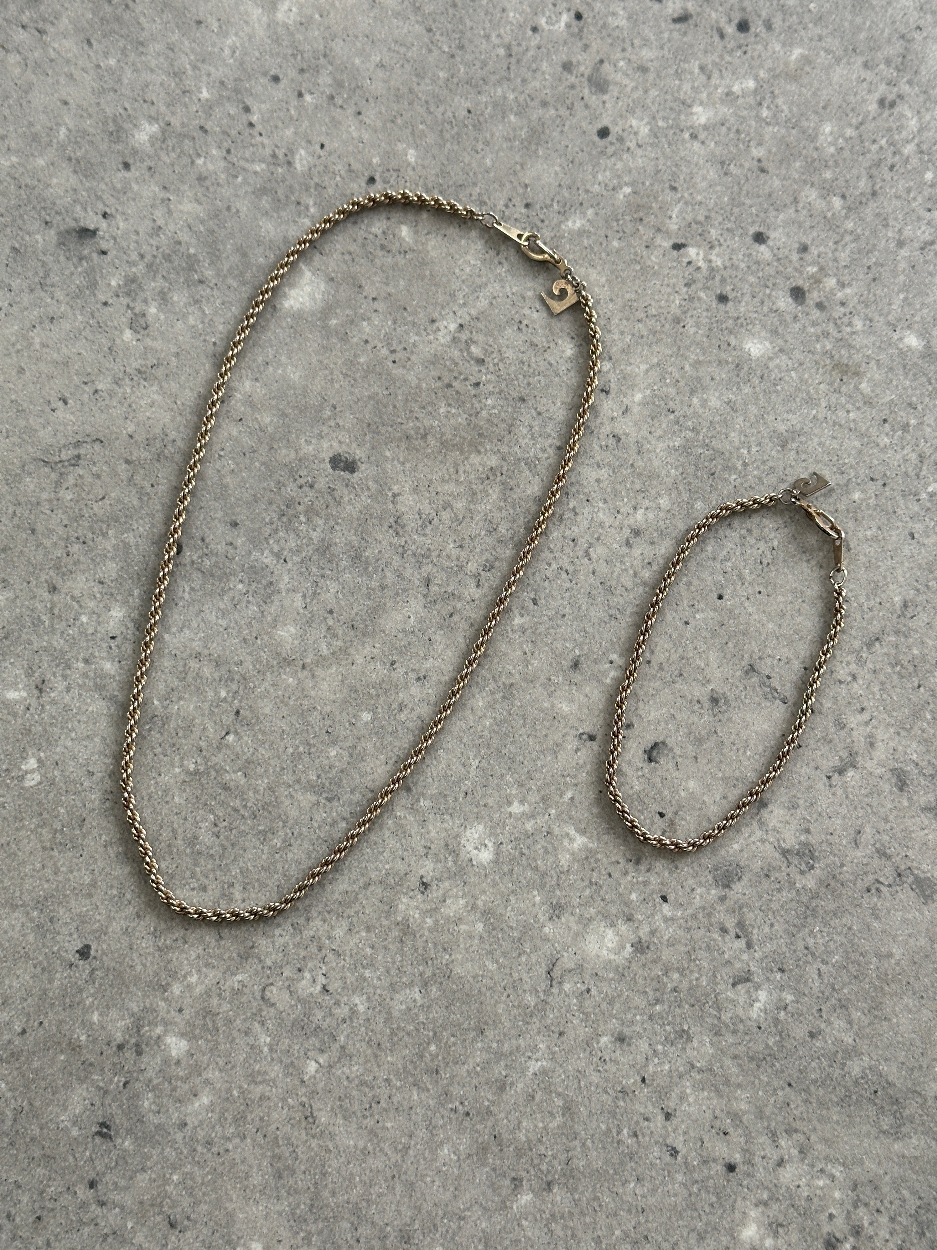 Pierre Cardin gold-plated necklace and bracelet chain set with linked design and polished finish, showcasing elegant jewelry.