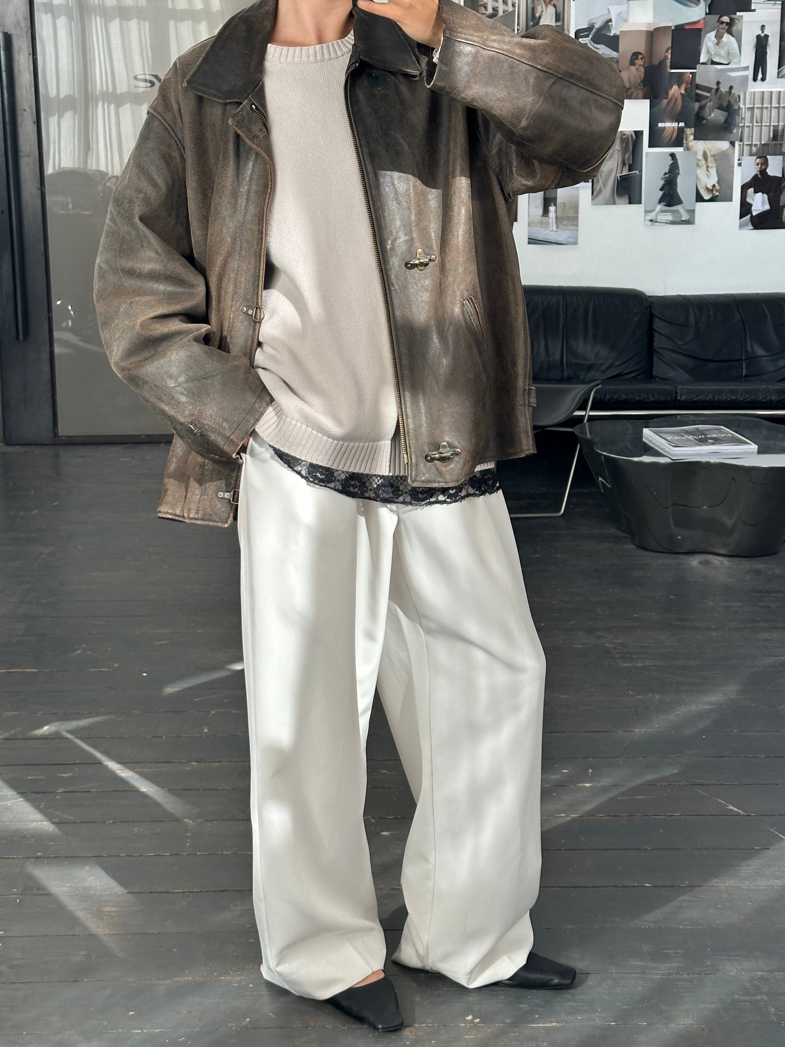 Vintage 1980s distressed leather jacket in XL size, featuring worn leather and classic design details.