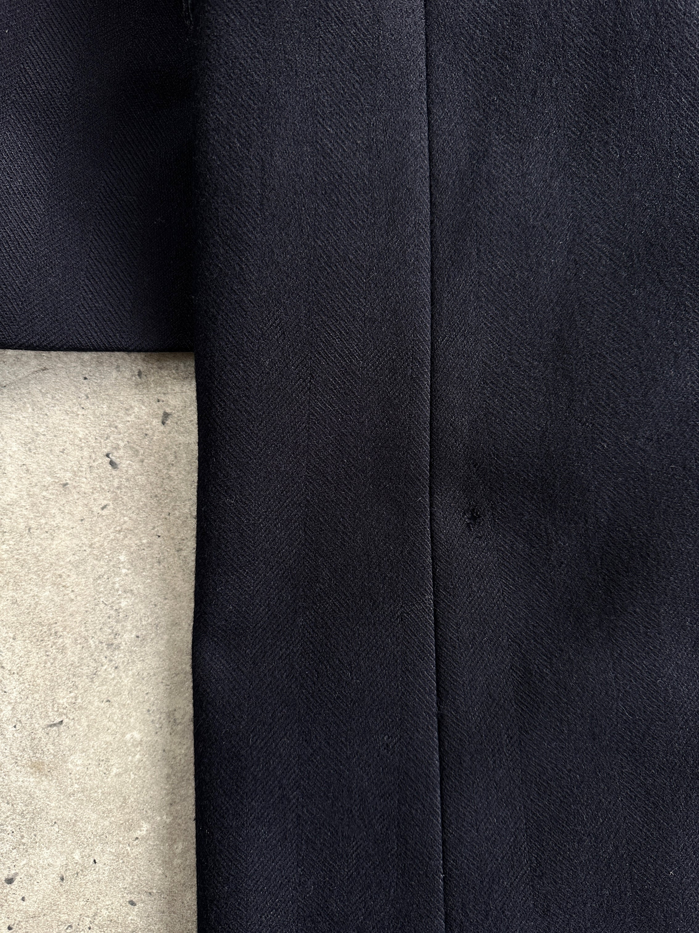 Christian Dior pure wool double-breasted coat in XL/XXL, showcasing a tailored design with classic lapels and button details.
