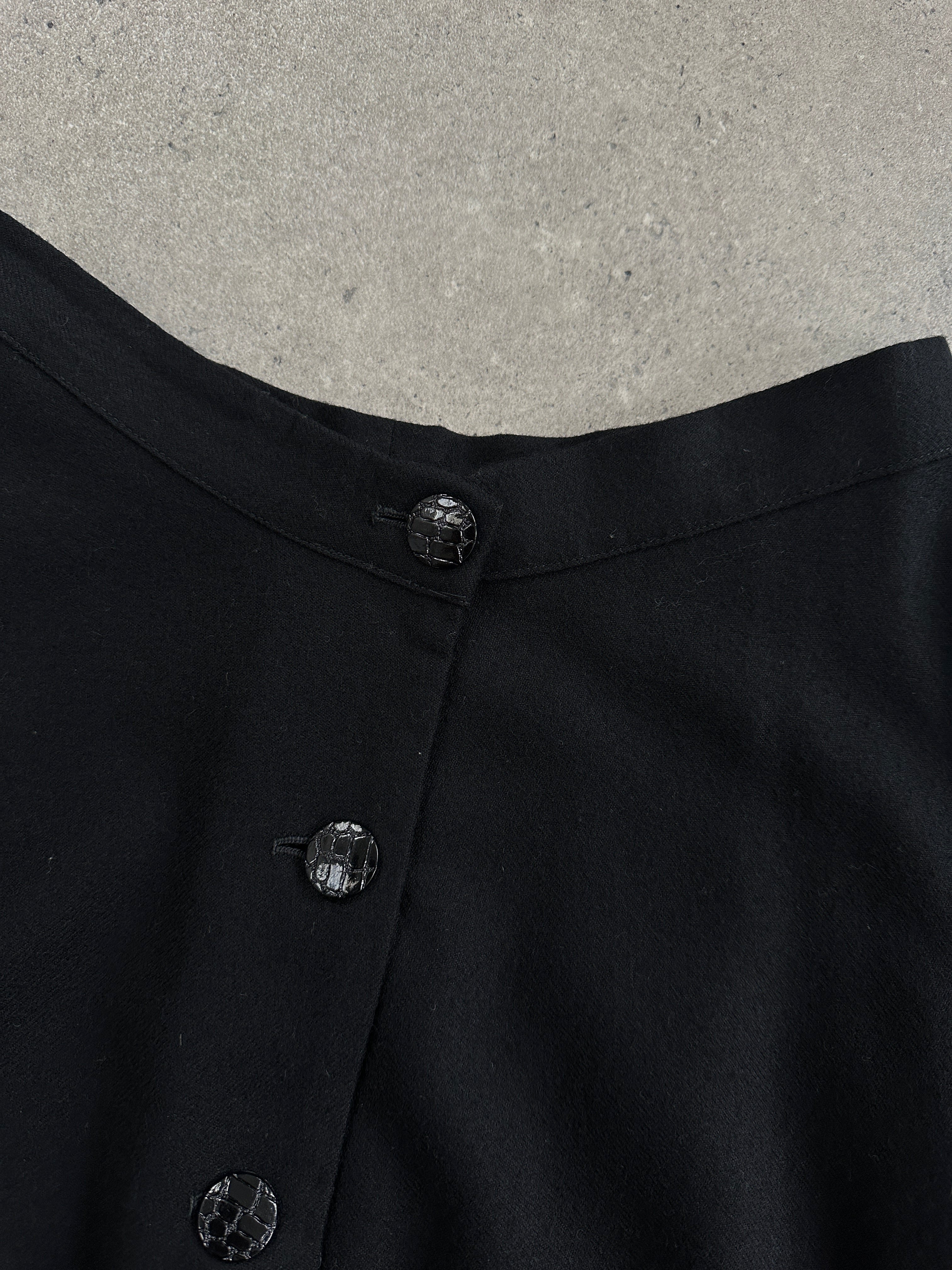Vintage pure brushed wool A-line skirt showing a classic, textured wool fabric in a vintage style with a high waist and flowing silhouette.