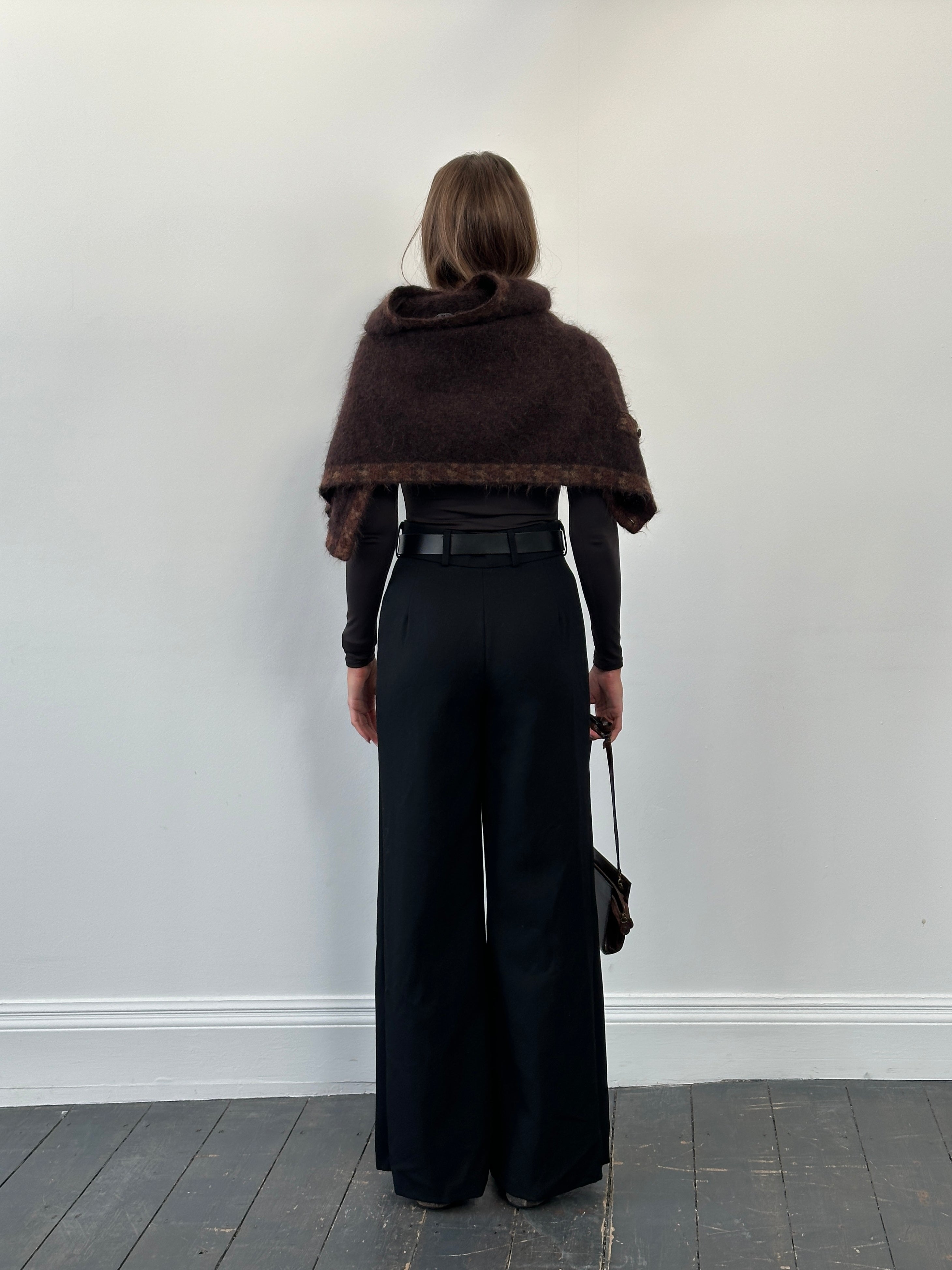Vintage 1990s pure wool tailored wide-leg trousers in size W26, showing the classic high-waist design and wide leg silhouette.